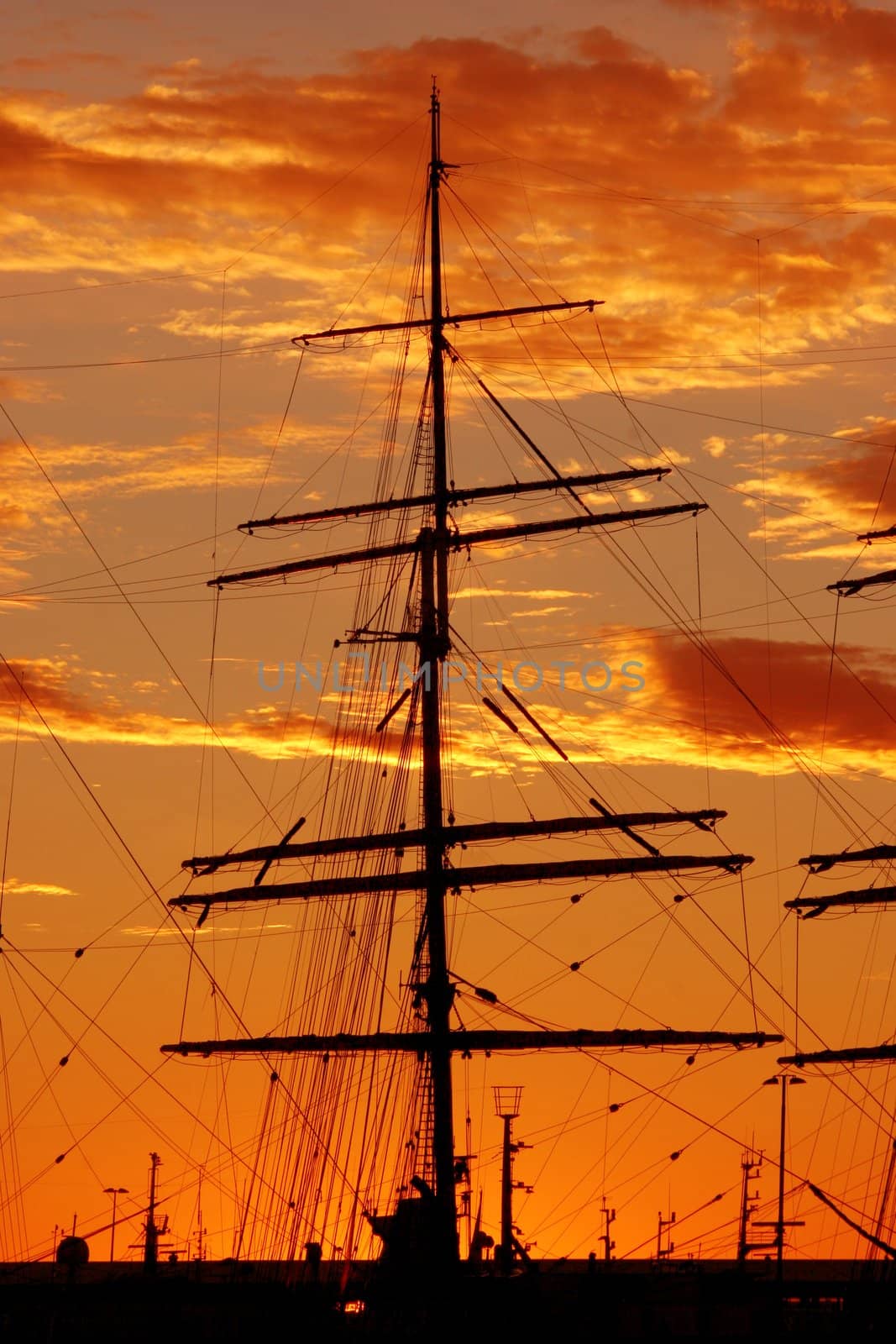 Silhouette of a schooner against the sunset