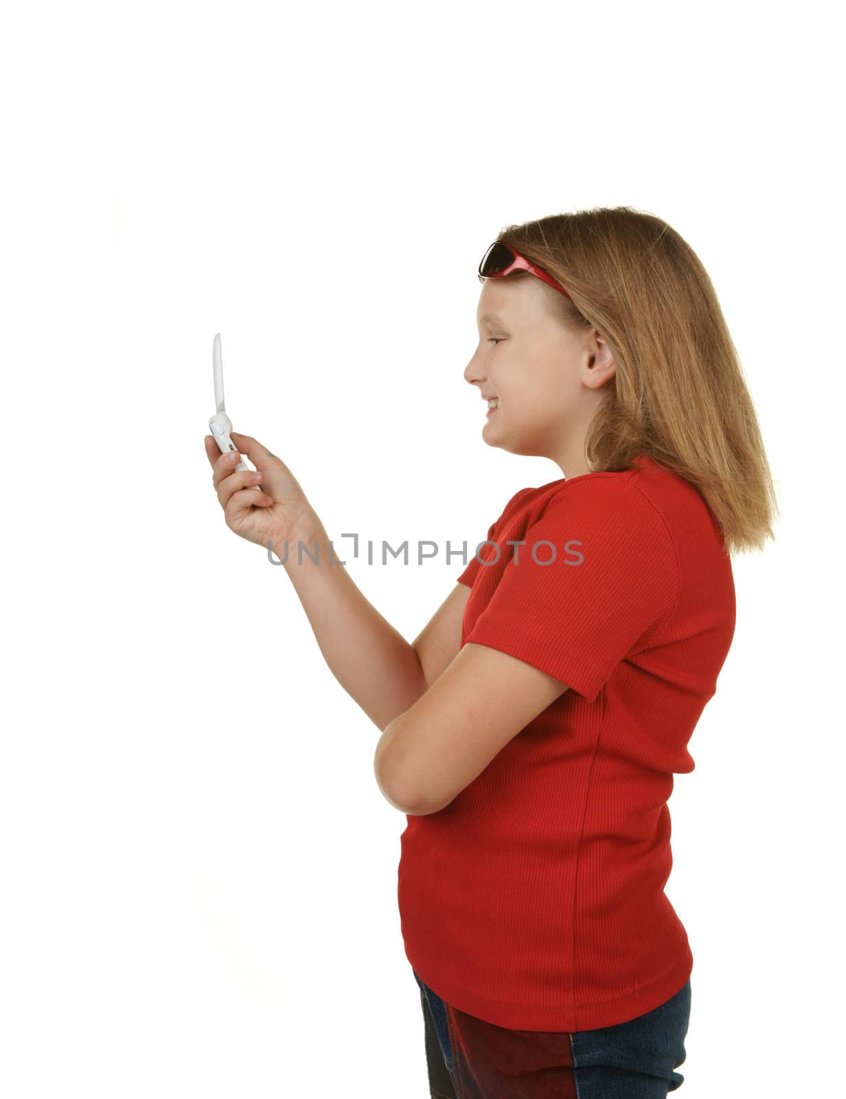 young girl sending a text message on white
