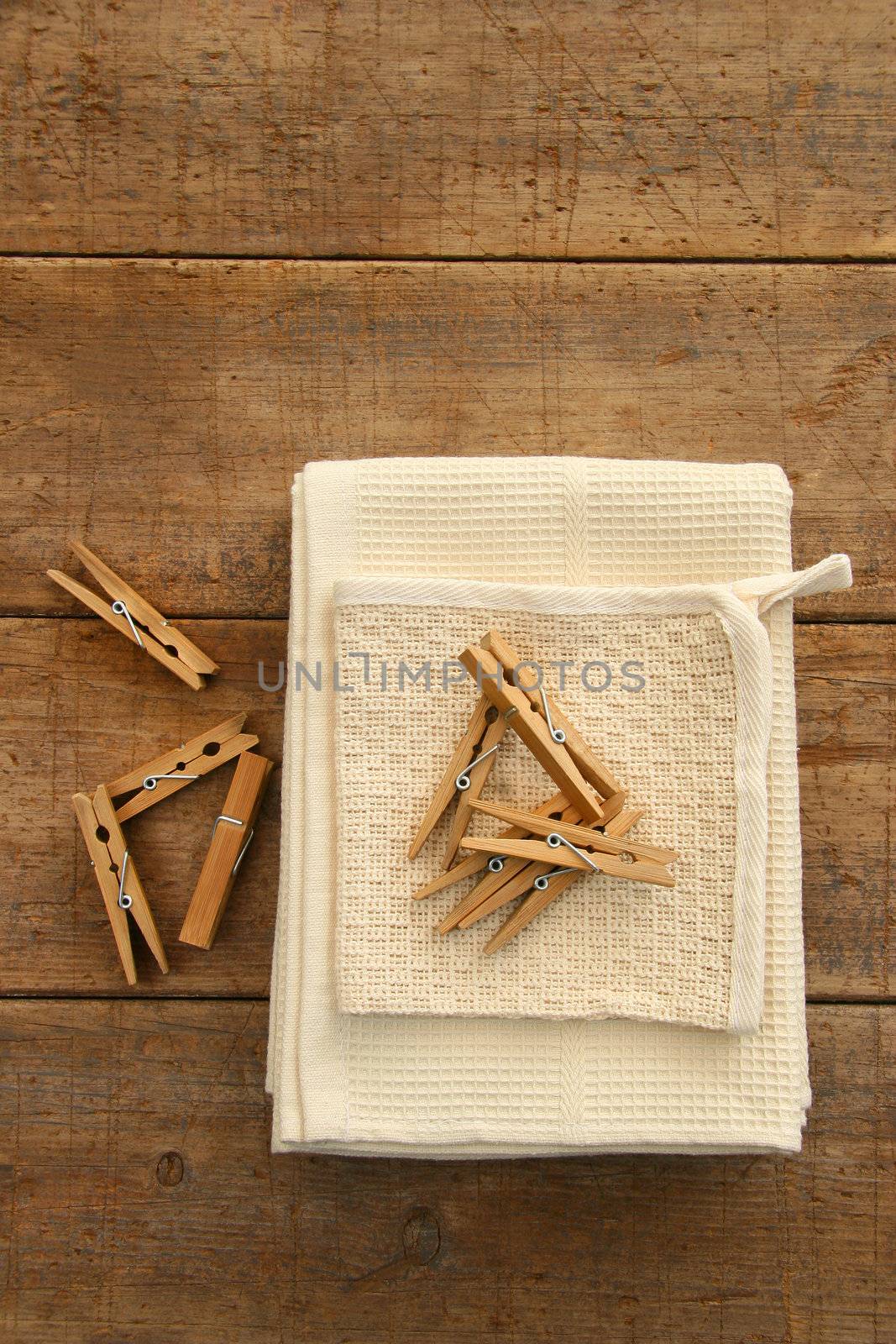 Cotton dish towel with clothes pins on antique table