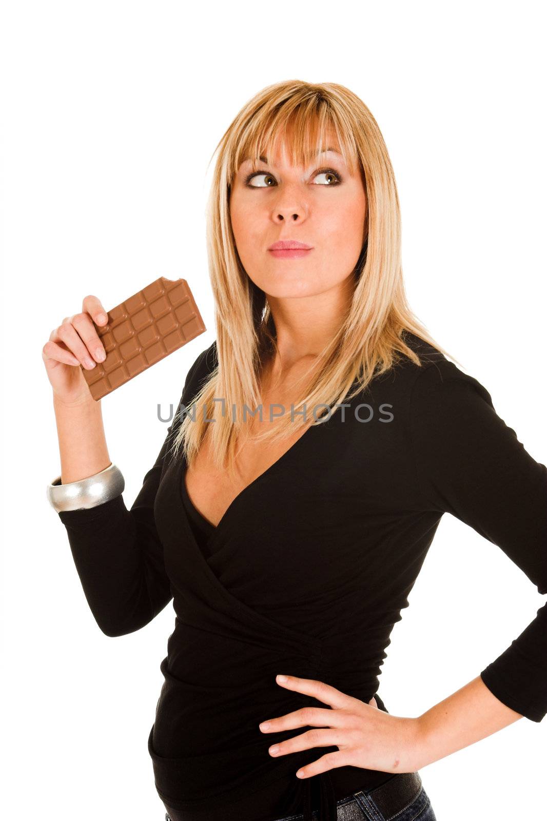 young girl eating chocolate on white background