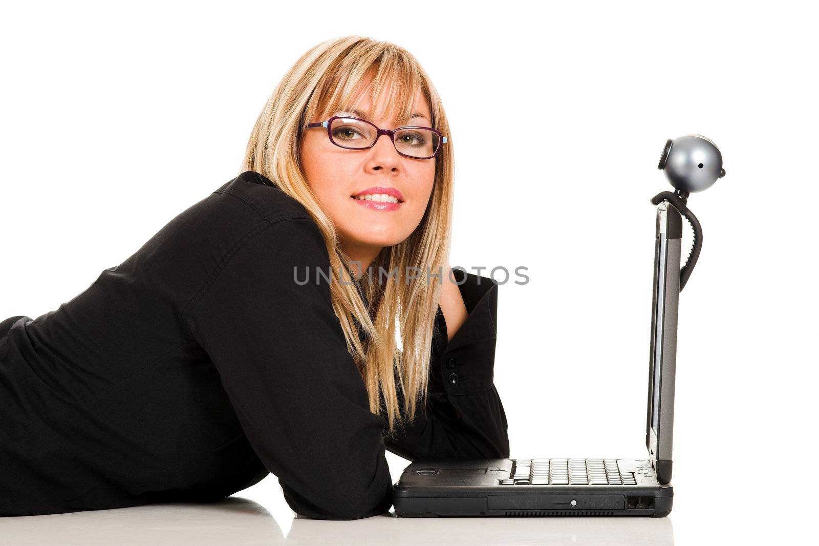 A businesswoman using laptop and webcam