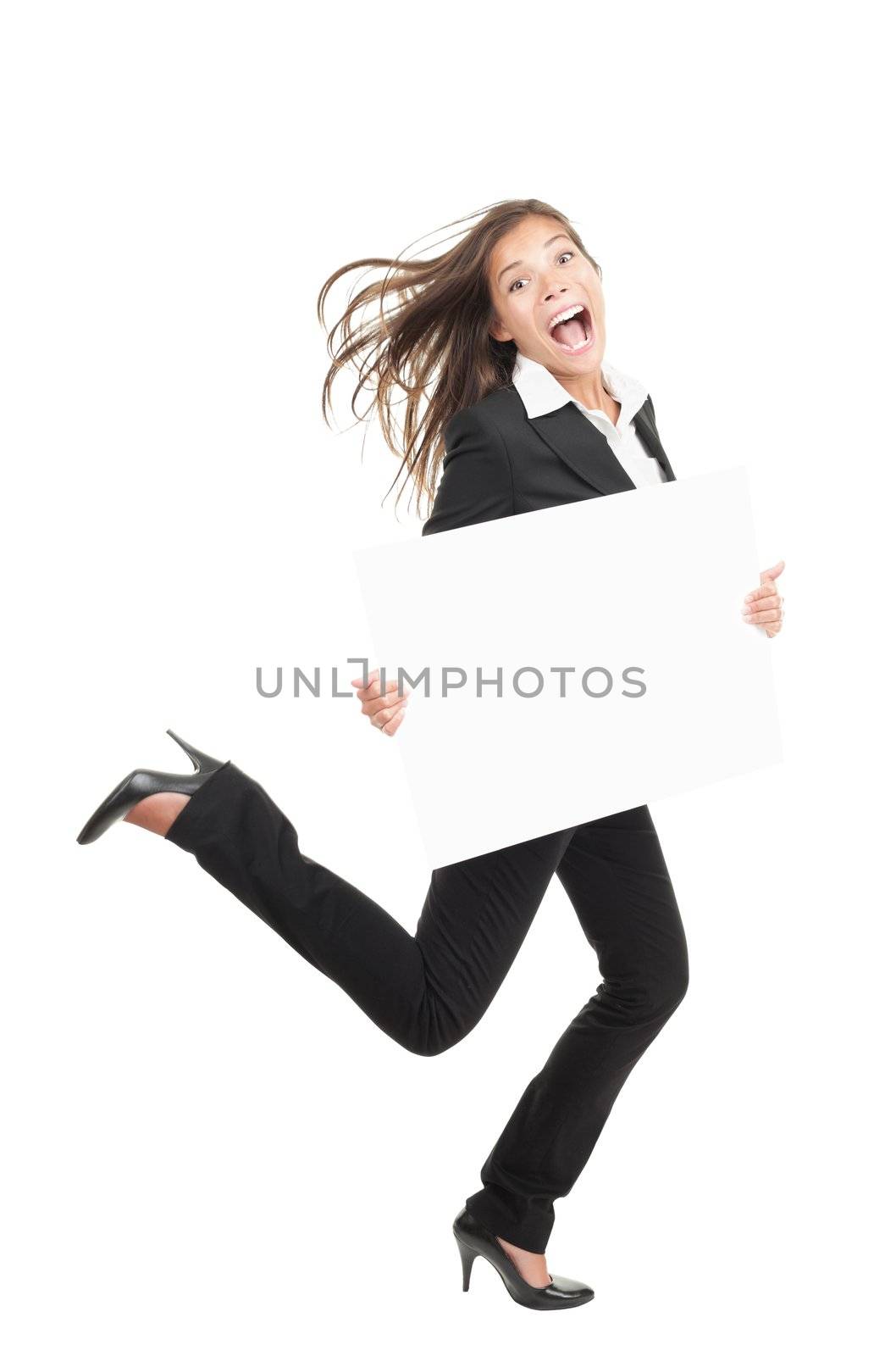 Funny businesswoman running holding a white empty commercial billboard or placard in full length. Beautiful mixed race chinese / caucasian woman isolated on white background. 