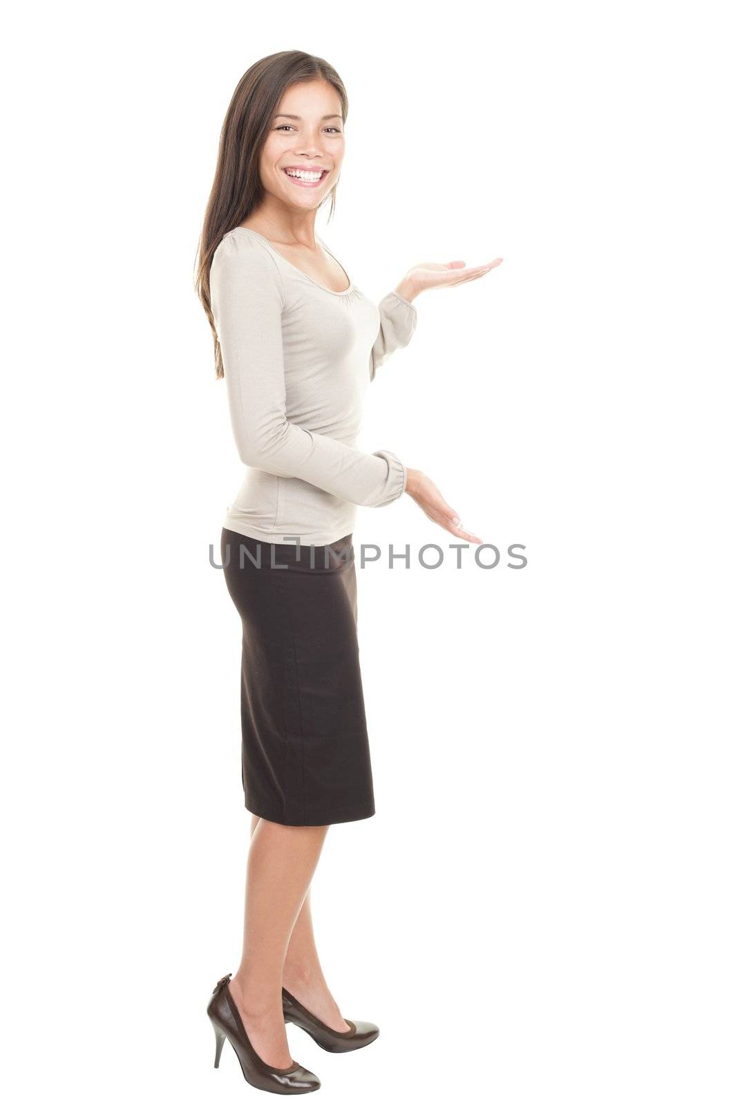 Casual businesswoman with a showing copy space gesture. Gorgeous kind looking young mixed race chinese / caucasian woman. Isolated on white background.