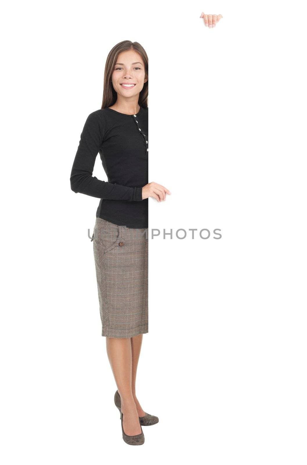 Billboard sign businesswoman. Full length portrait of casual young businesswoman standing with blank white billboard paper sign. Mixed race chinese / caucasian model isolated on white background.