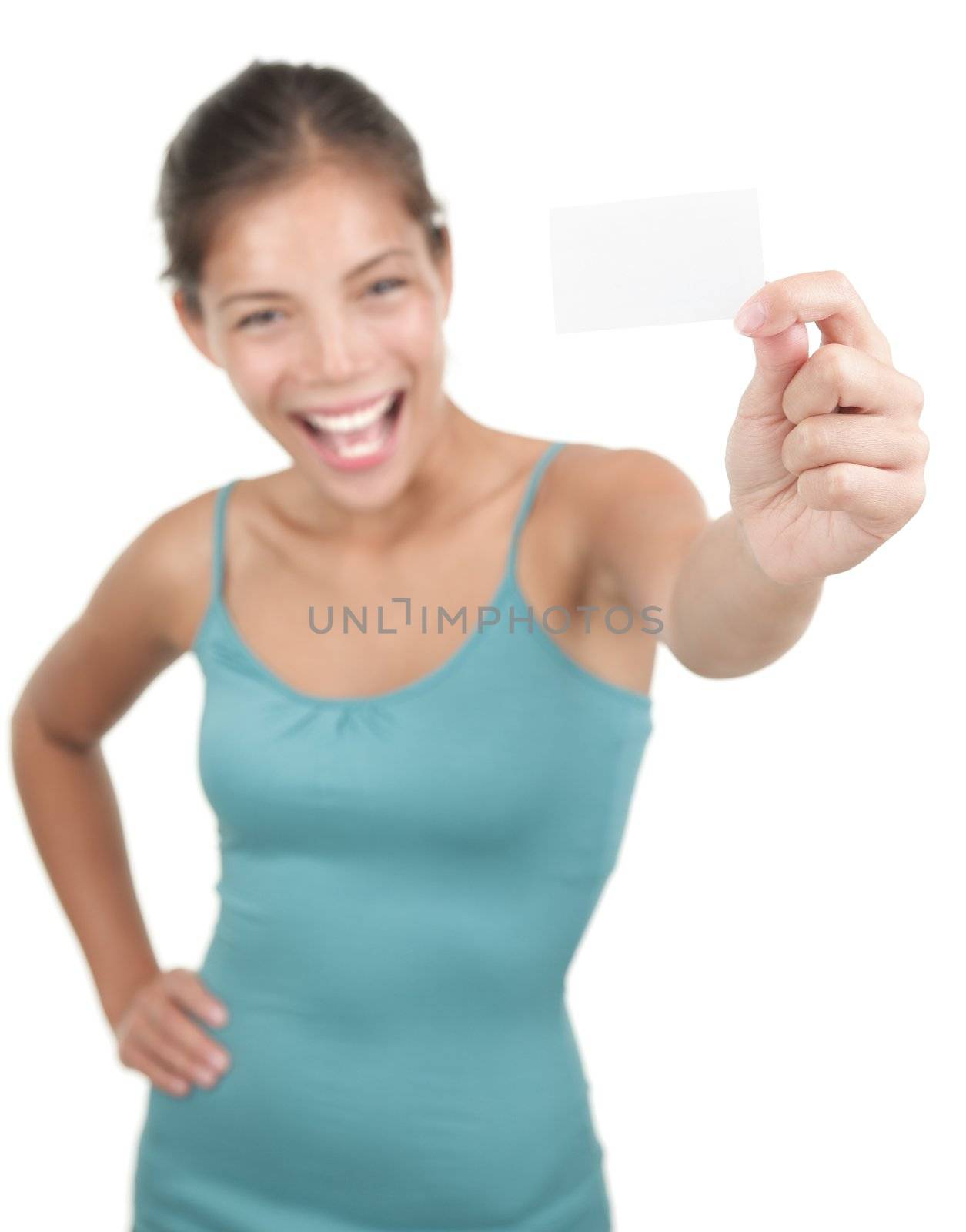 Blank sign / business card. Beautiful young woman with an excited big smile displaying a blank business card / notecard. Shallow depth of field, focus on card. Isolated on white background. Mixed race asian / caucasian model.