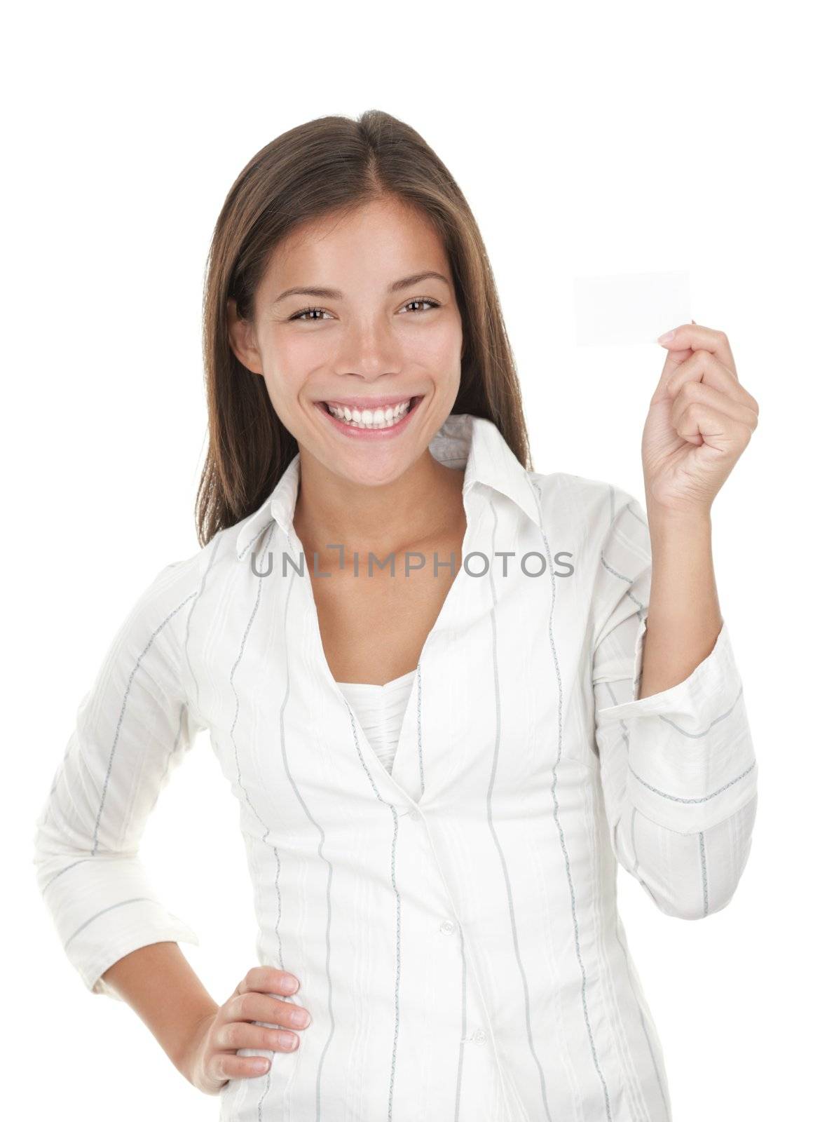 Business card woman. Portrait of a young beautiful businesswoman holding a blank white paper sign. Mixed race chinese / caucasian woman isolated on seamless white background.