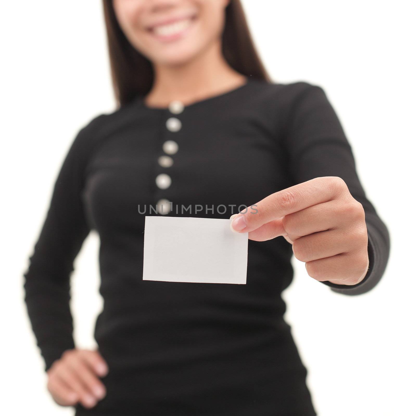 Young casual professional showing blank white business card / paper sign. Isolated on white background.
