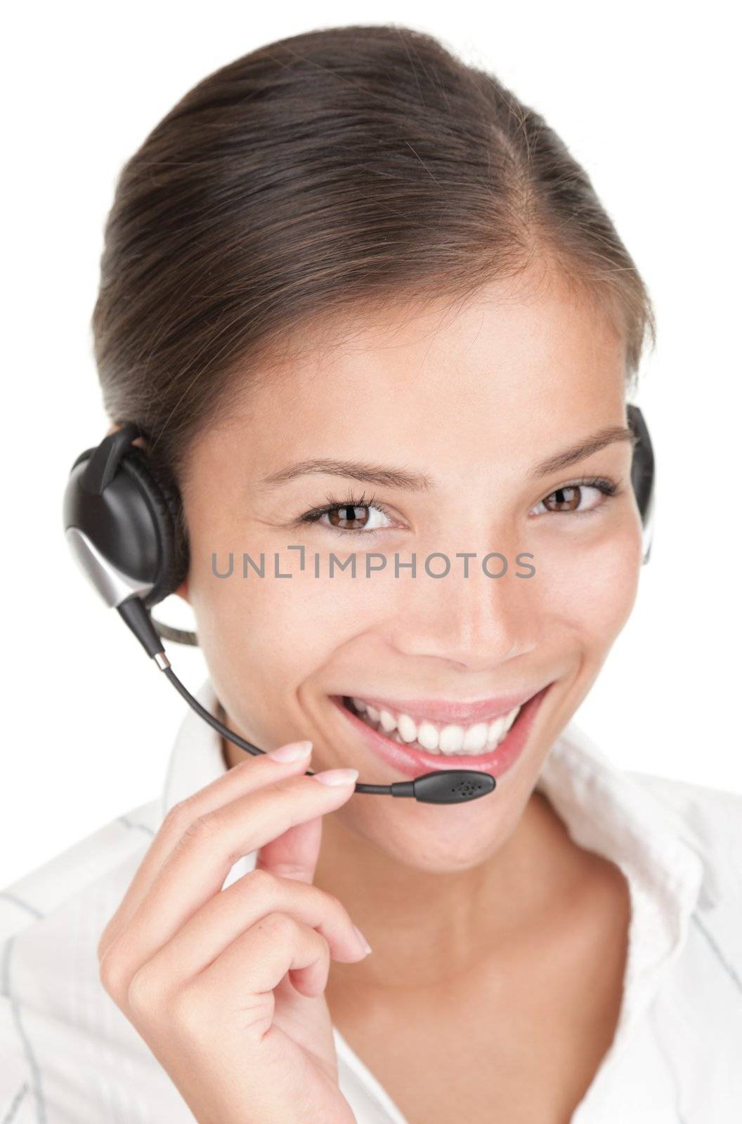 Call center woman with headset. Beautiful smiling mixed race chinese / caucasian woman isolated on white background. 