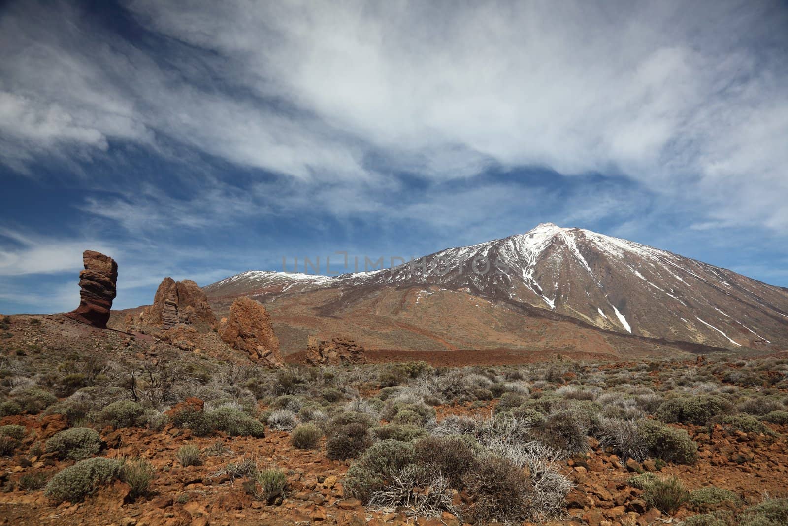 Teide on Tenerife. Snow covered Teide in the beautiful landscape in the national park on Tenerife with the famous rock, Cinchado in the scene. 
