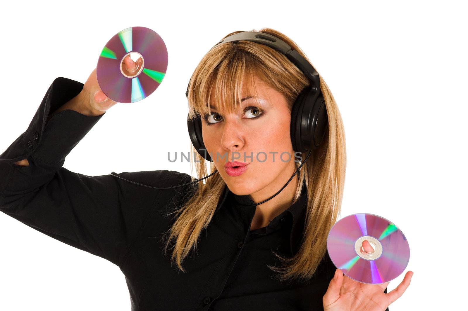 beautiful young woman listening music in headphones and holding two CD 