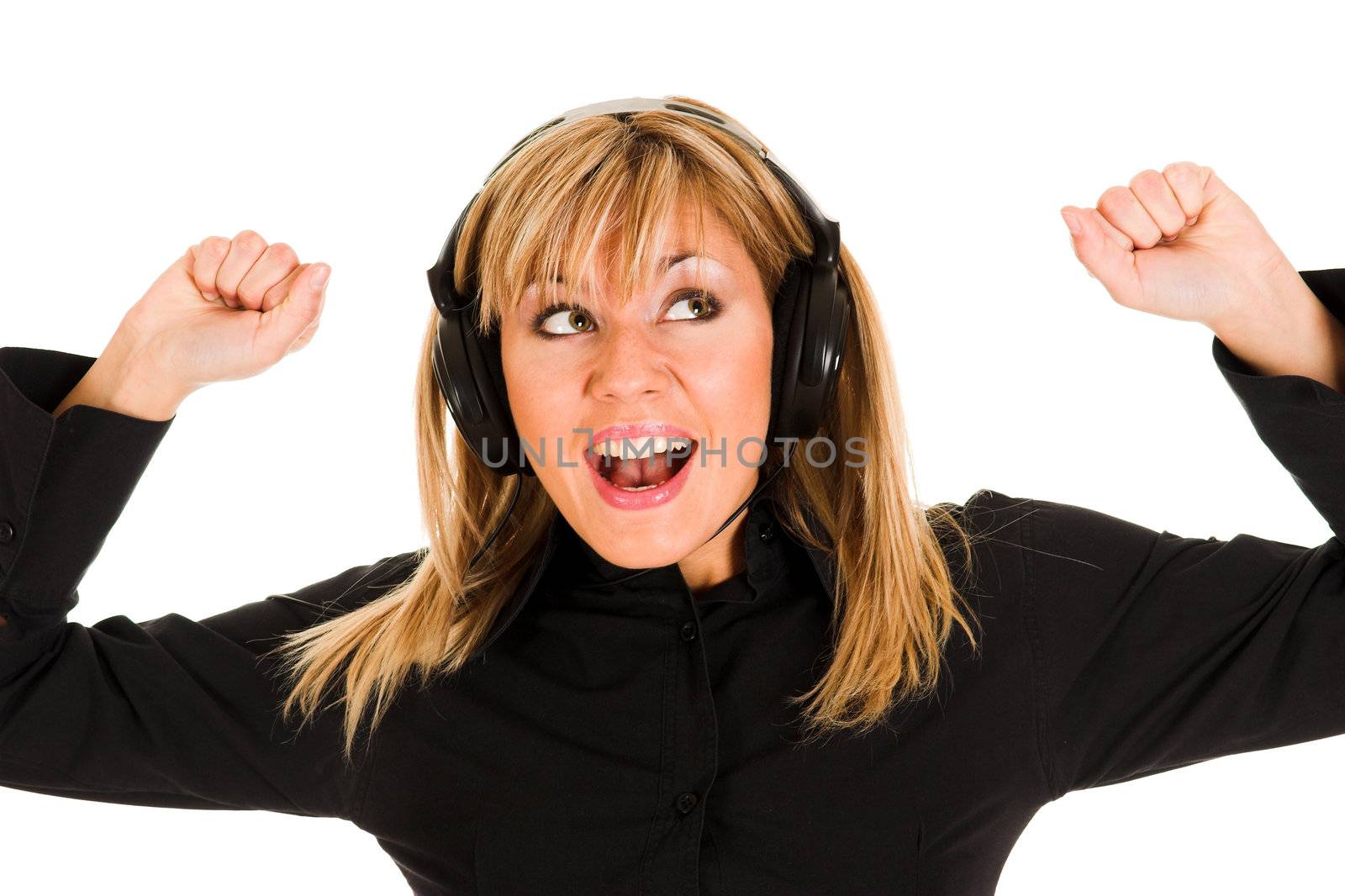 beautiful smiling young woman listening music in headphones
