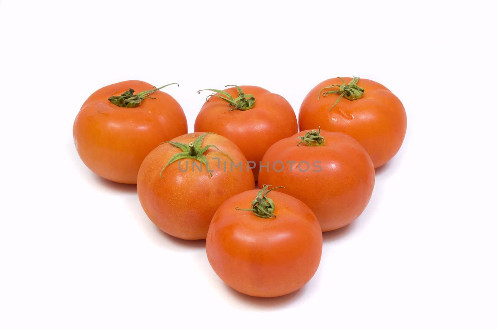arrangement of fresh organic tomatoes, isolated on white, copy space