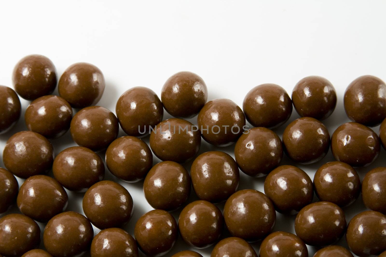 Chocolate candies on white background