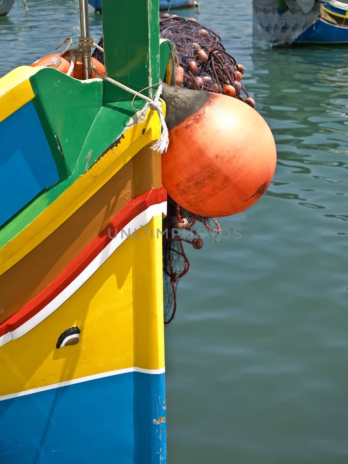 Traditional fishing boats of Malta called Luzzu or Dghajsa in the fishing village of Marsaxlokk