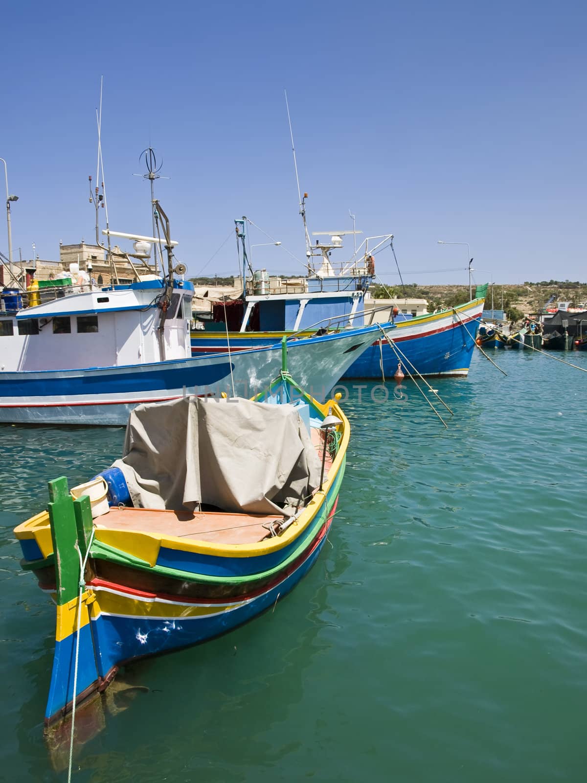 Traditional fishing boats of Malta in the fishing village of Marsaxlokk