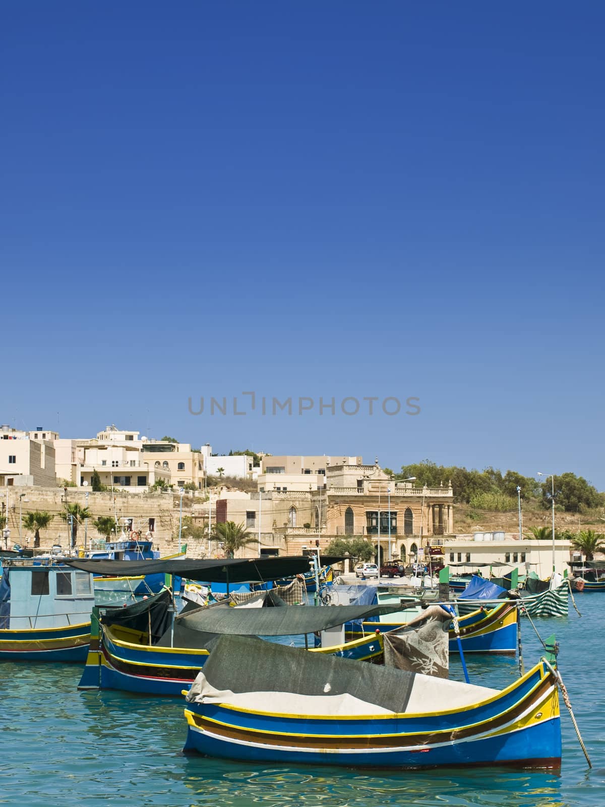 Traditional fishing boats of Malta in the fishing village of Marsaxlokk