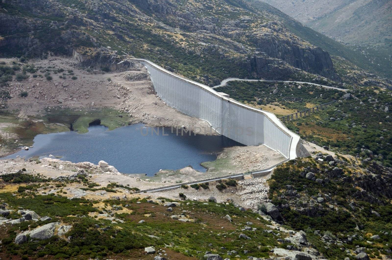 hydroelectric basin and dam situated in mountain area by raalves
