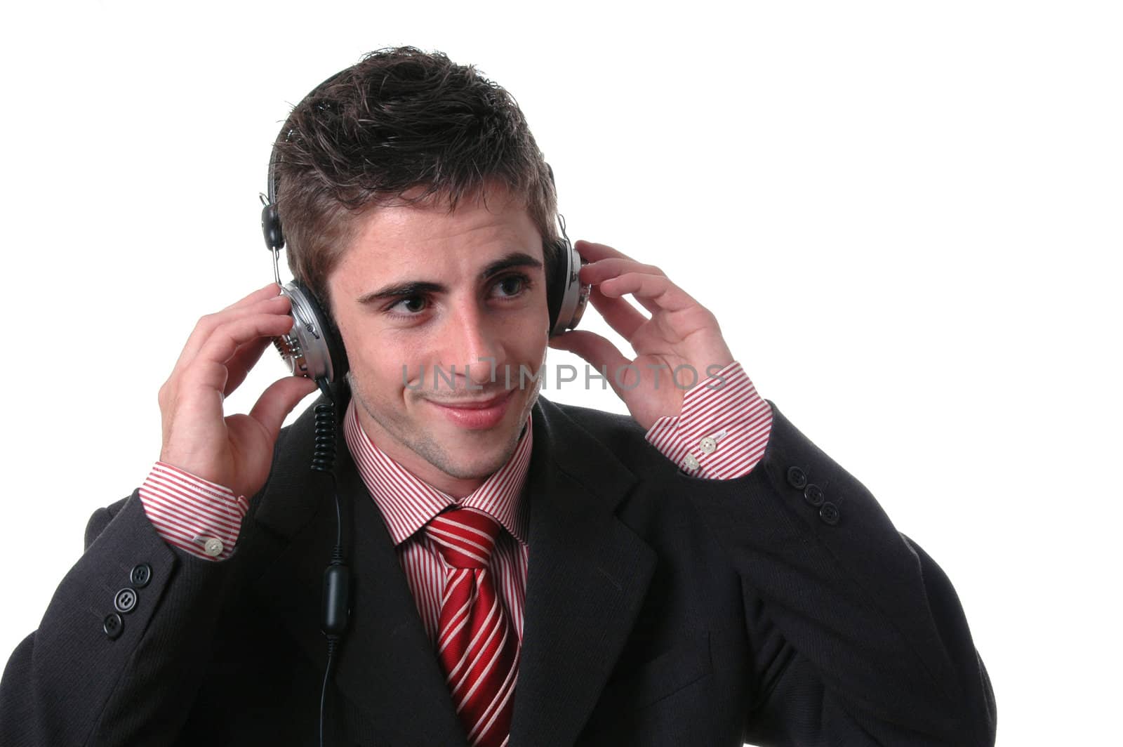 young businessman listen music on white