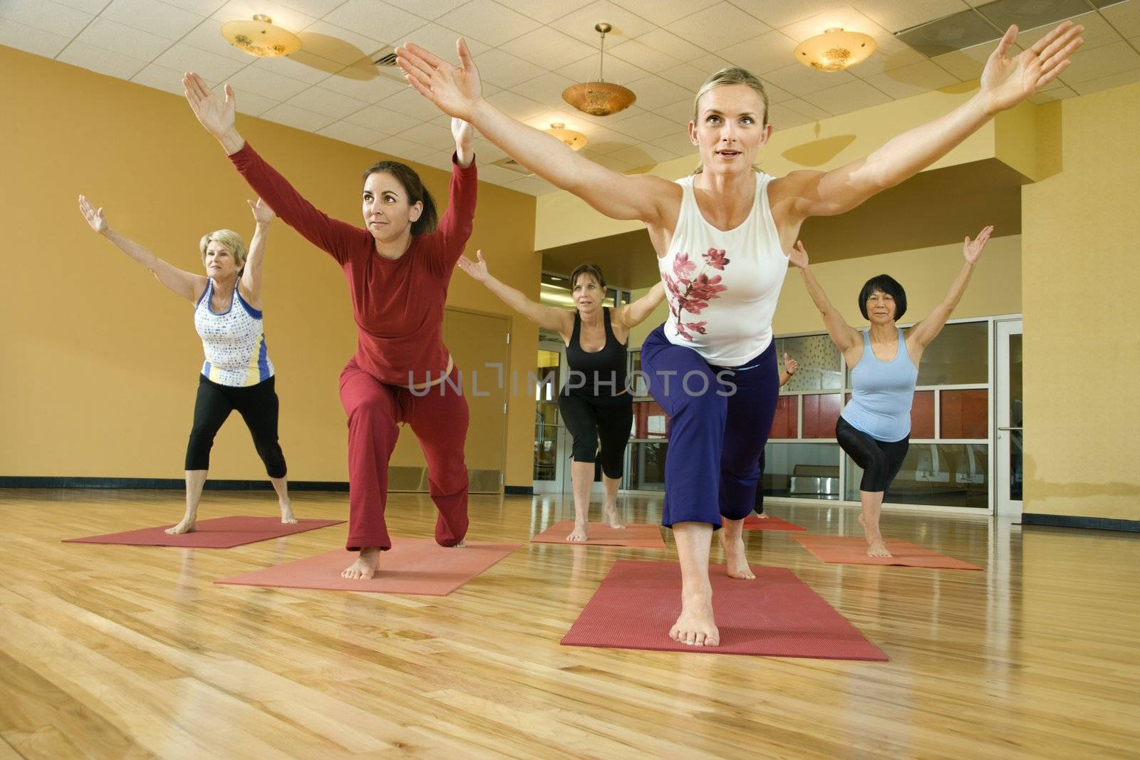 Prime adult female Caucasians in yoga class.