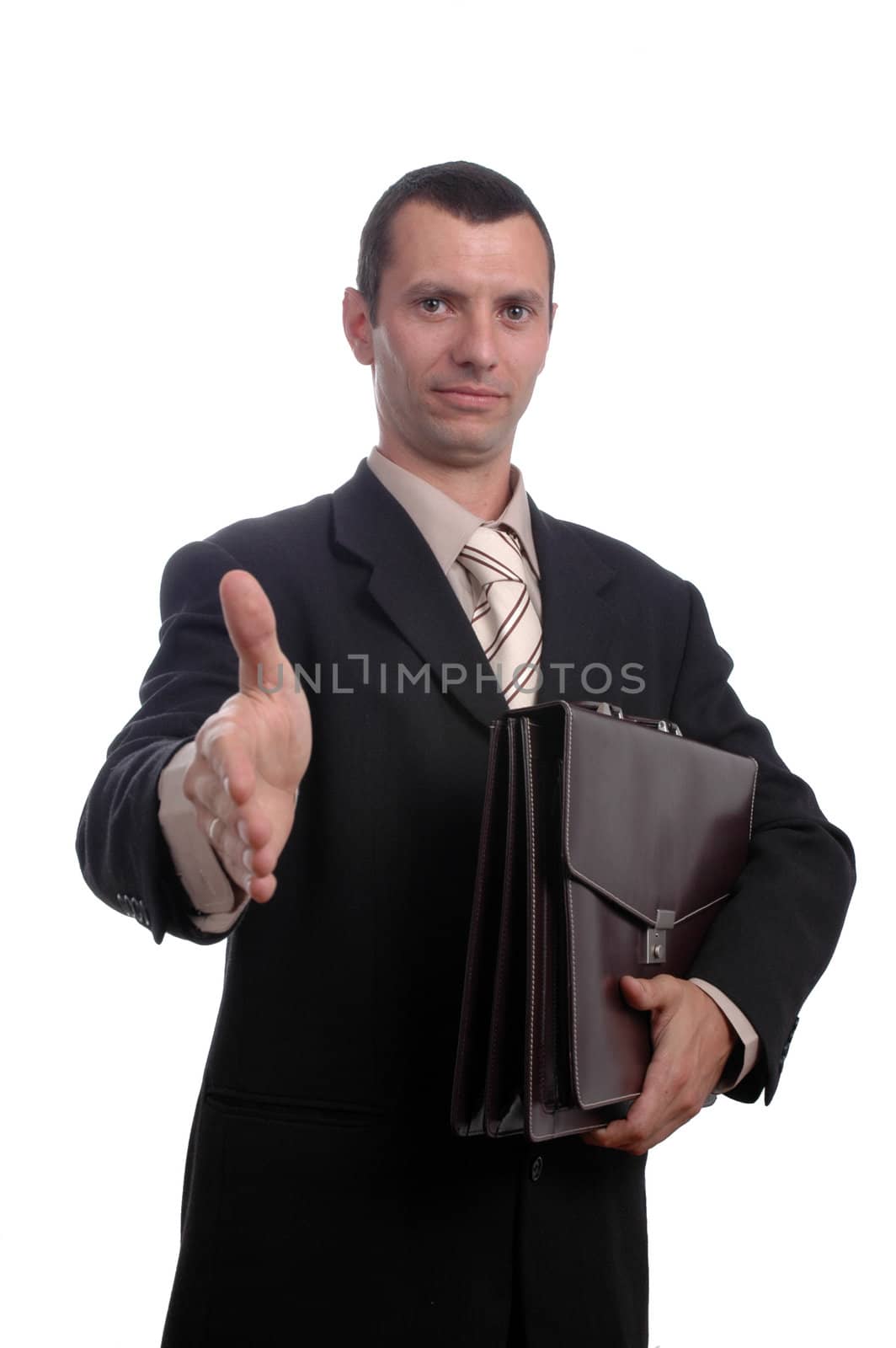 Businessman holding a document wallet welcoming you with a handshake.