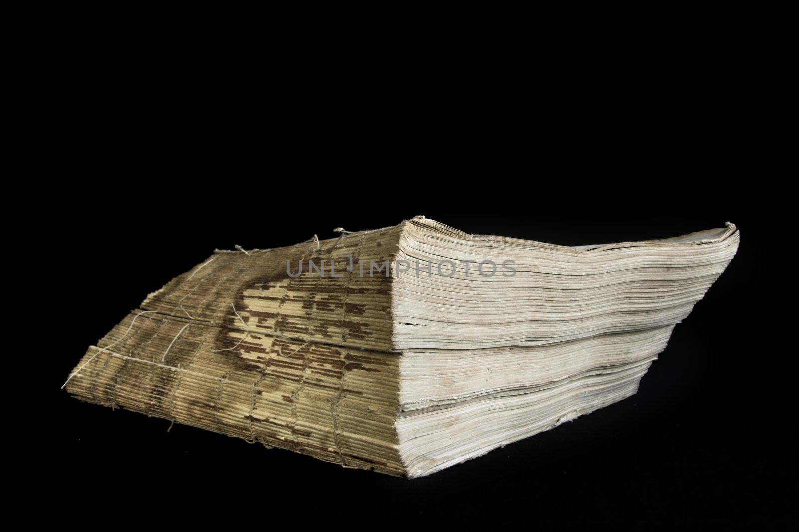 Old book on a black background