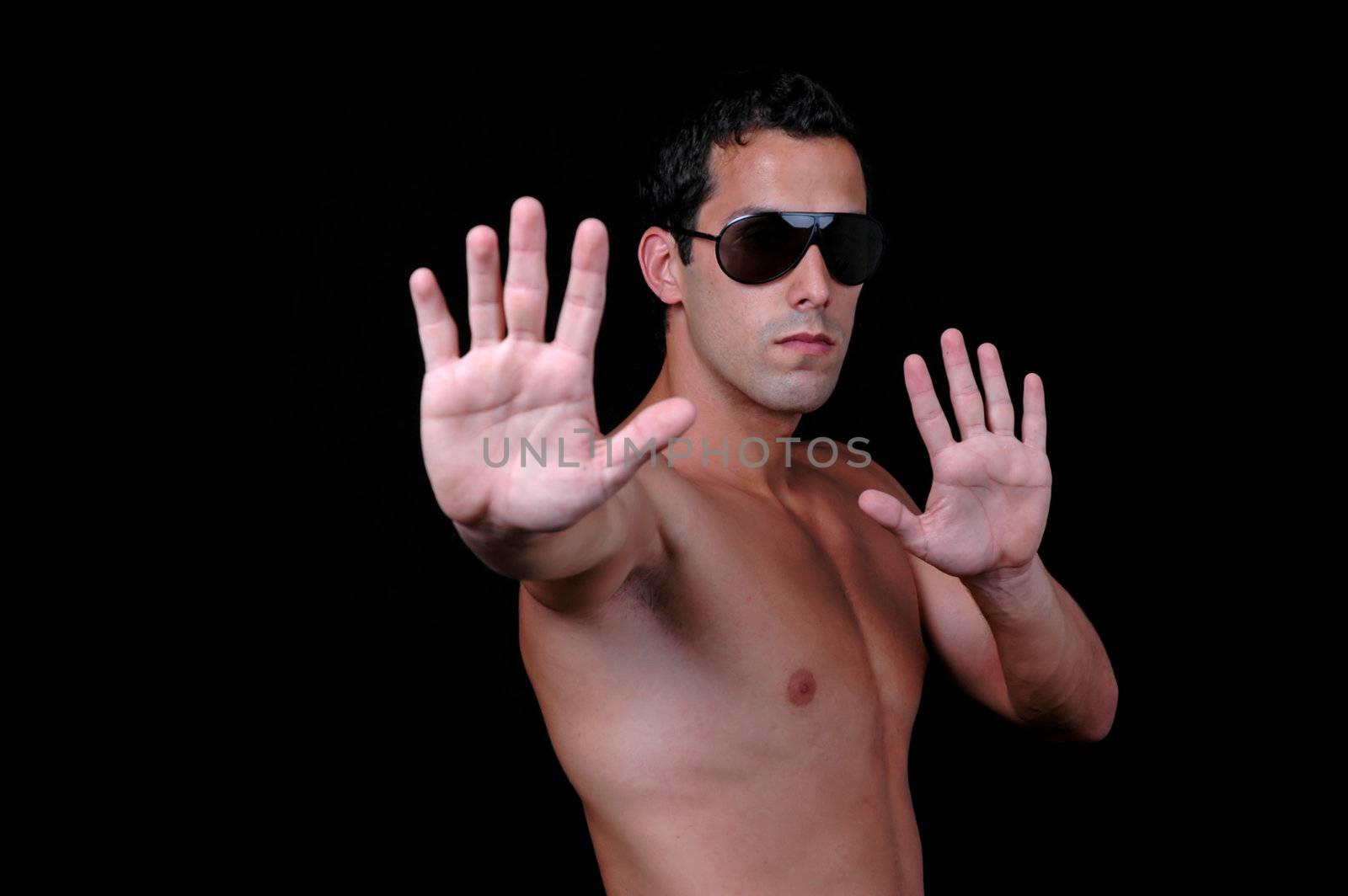 Please! stop! Young shirtless man holding his hands out saying 'stop'