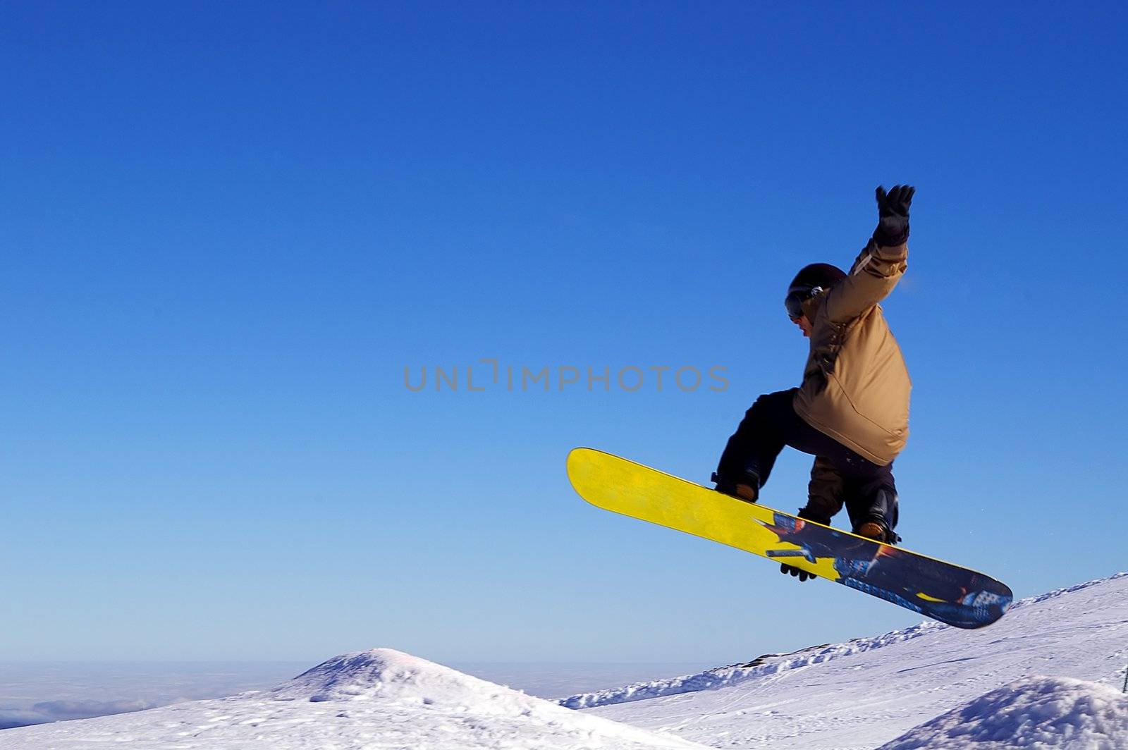 Snowboarder Jumping high in the air 