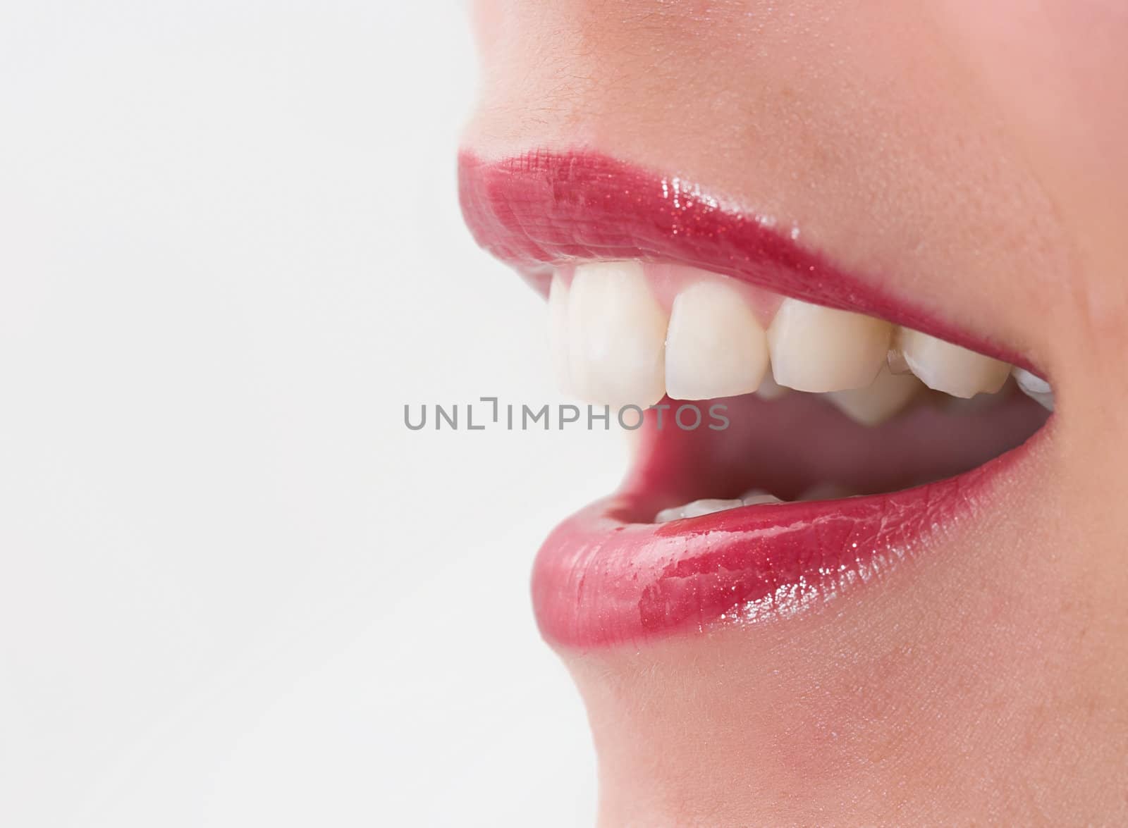 Beautiful mouth with red lipstick with shallow depth of field