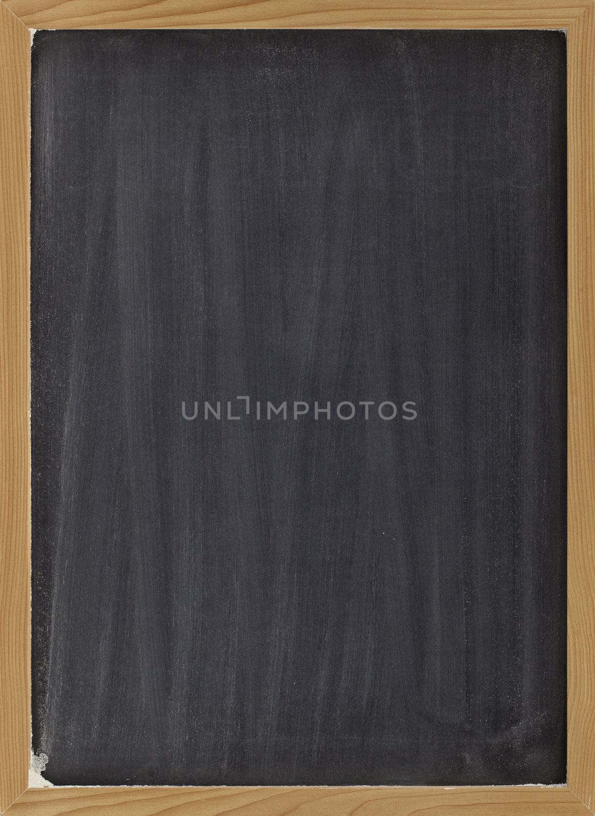 blank blackboard with vertical white chalk smudges, ready to be used as a menu or other sign