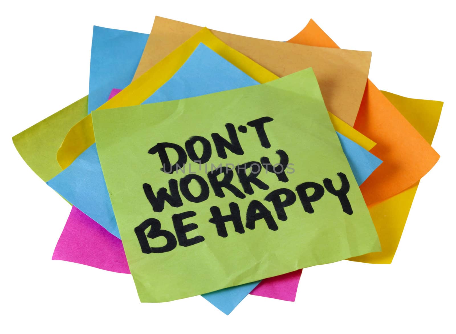 don't worry be happy phrase, a quote from Meher Baba, an Indian mystic and spiritual master (before it was used in a song lyrics), handwriting on a pile of sticky notes isolated on white