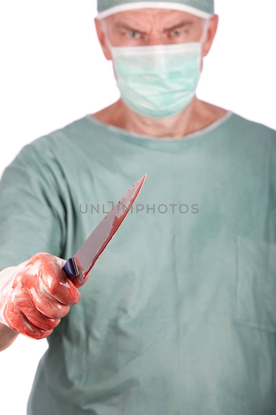 A 60 year old surgeon holding a bloody nice. Malpractice concept.