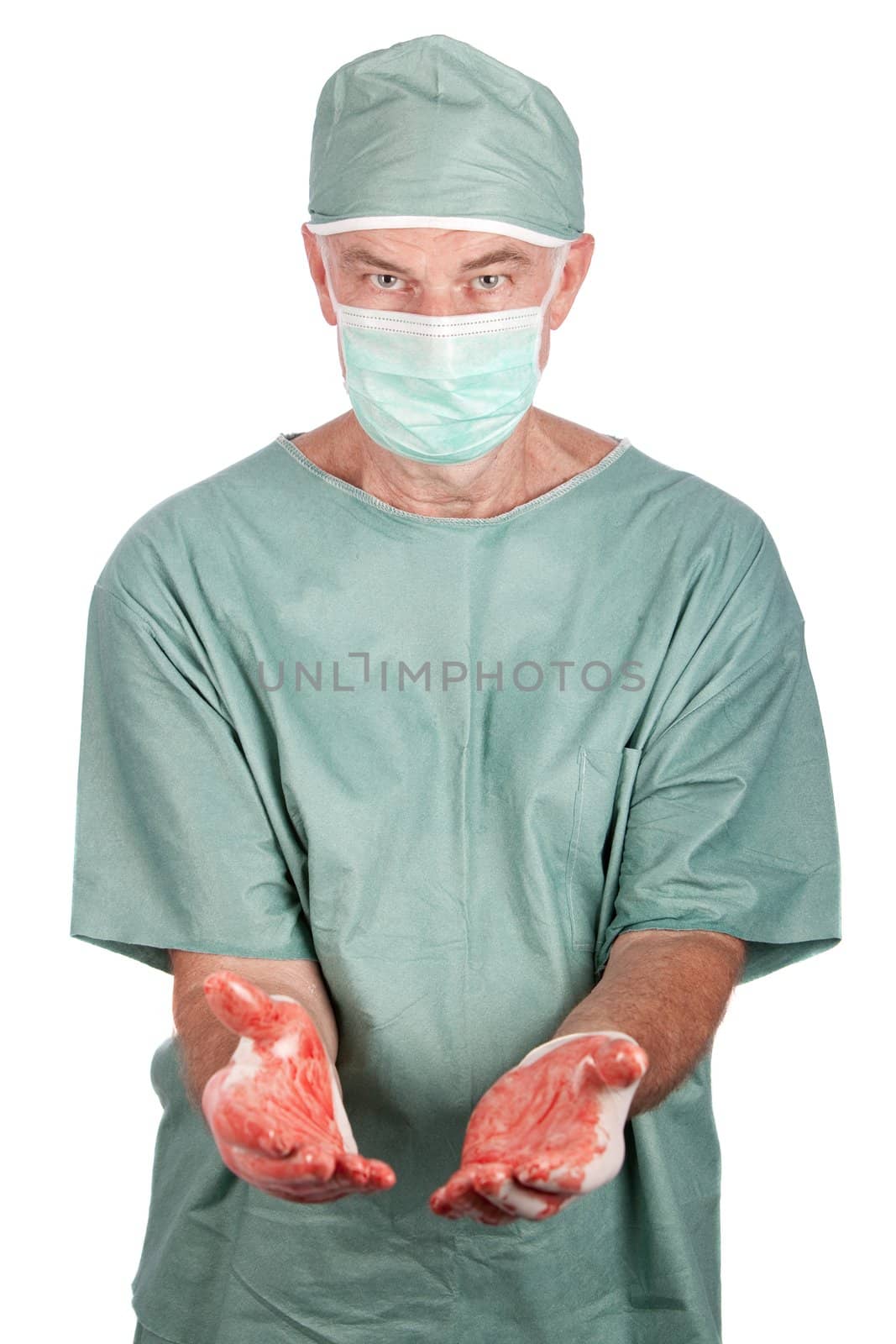 A 60 year old surgeon with bloody hands on a white background.