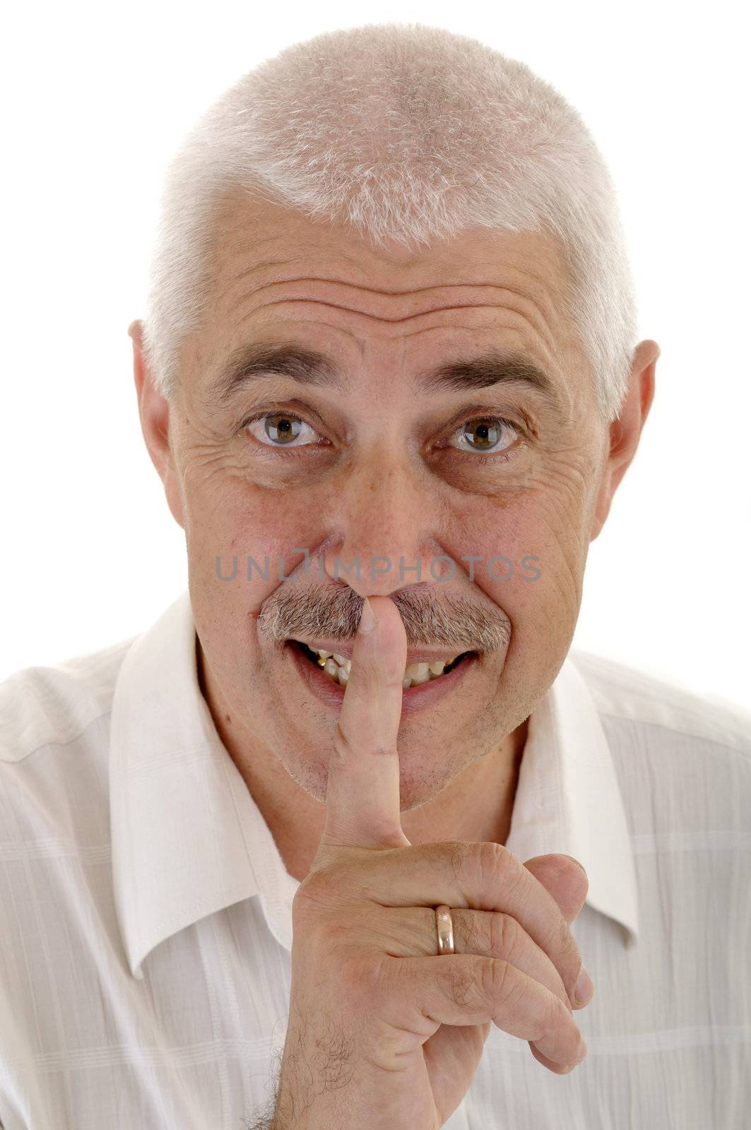 Senior gray man with shh gesture