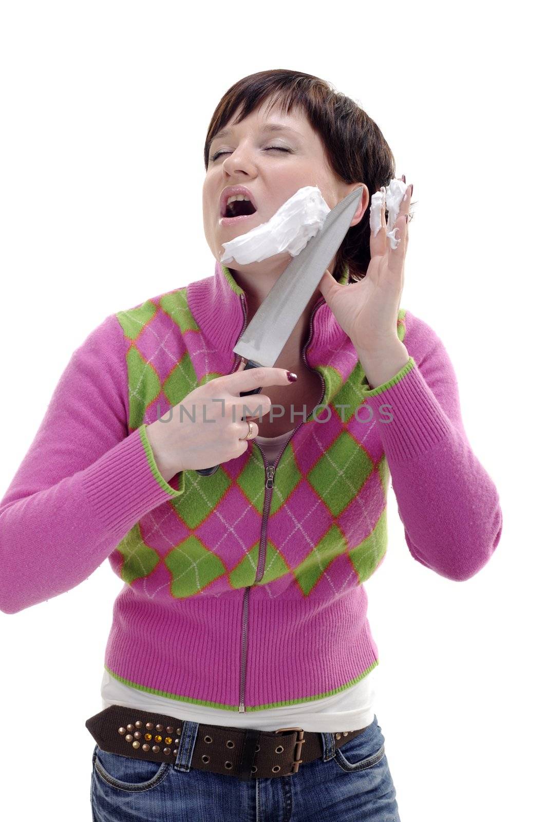 young woman with knife and foam on her face
