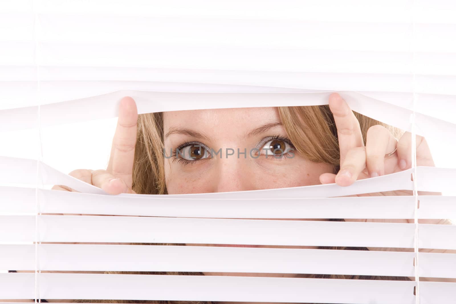 woman hands apart on the window blinds
