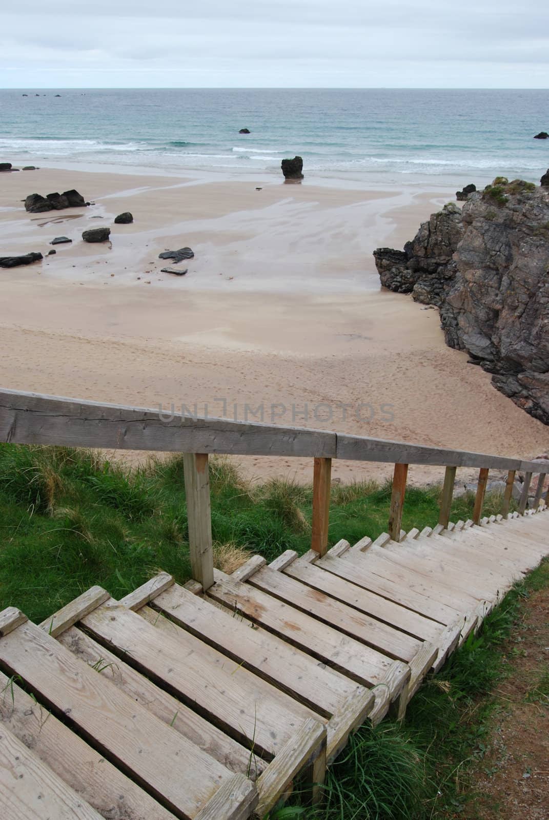 wooden stairs to a rocky beach in northern Scotland