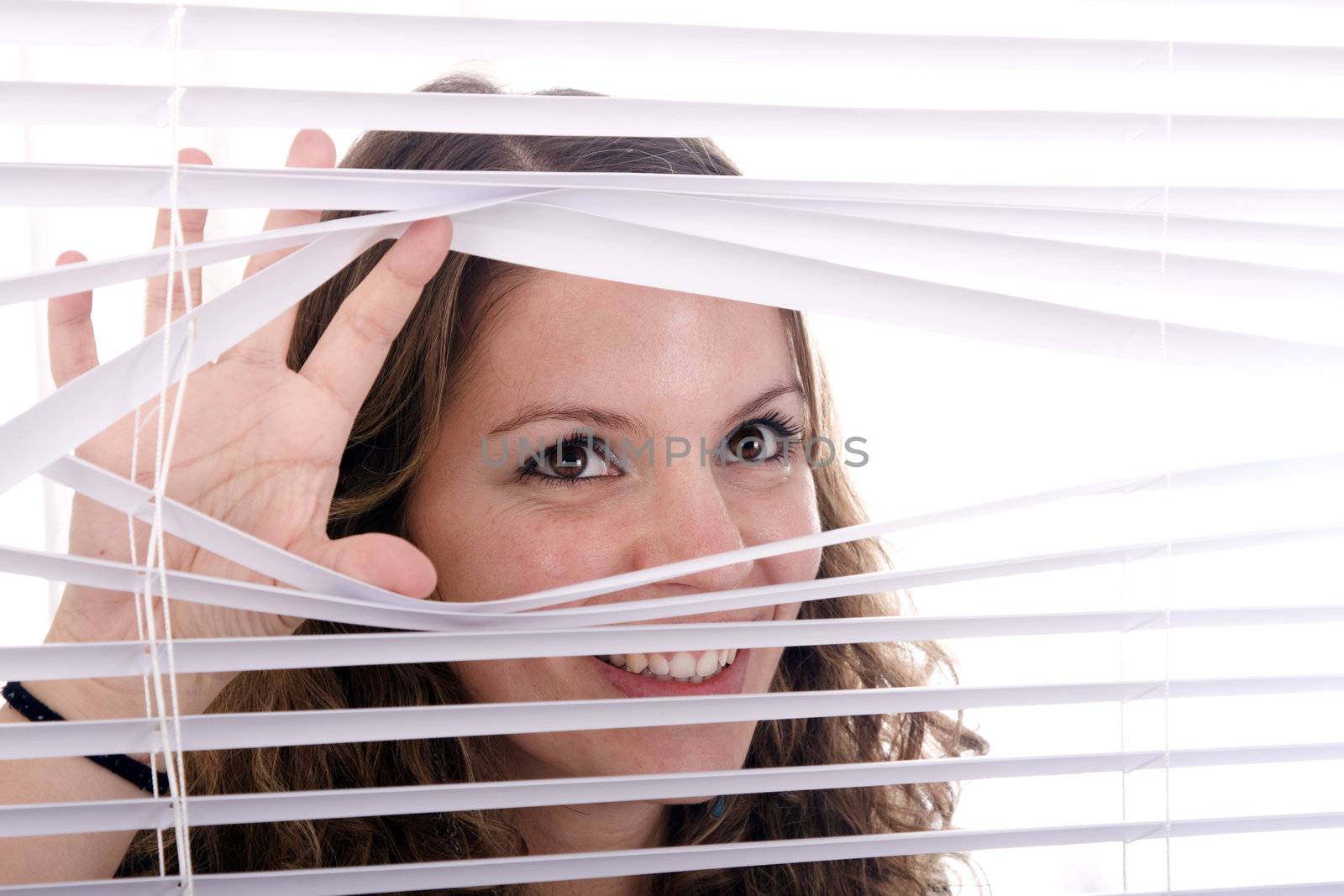 woman hands apart on the window blinds
