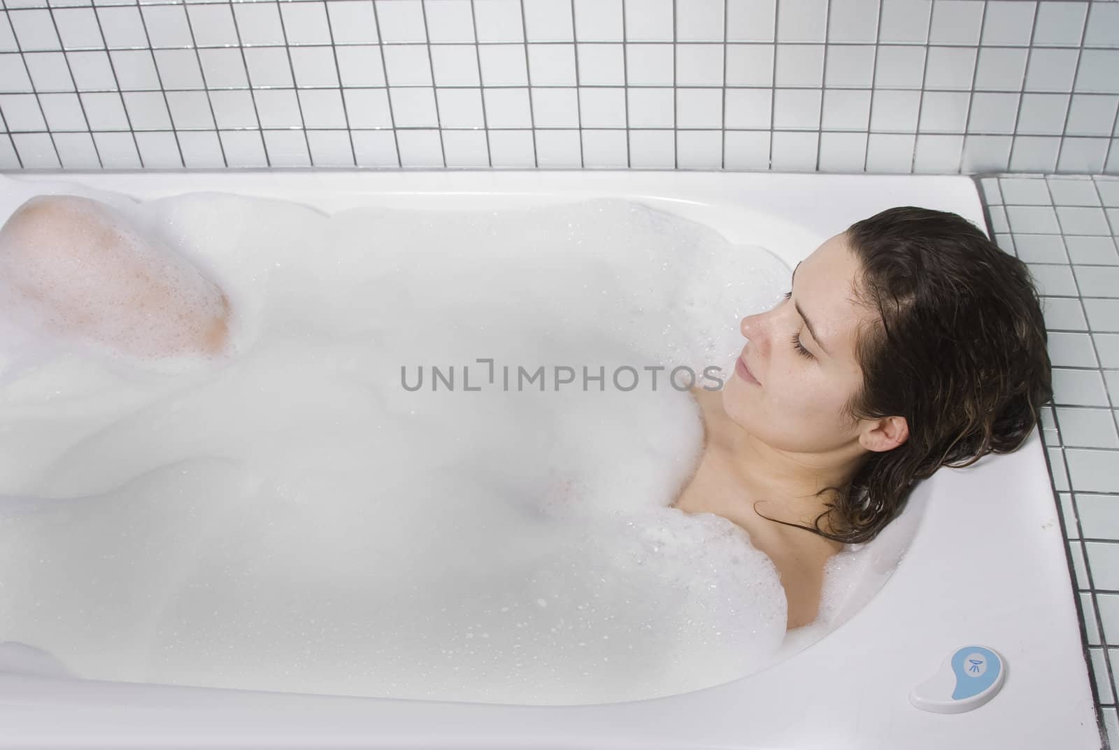  woman enjoys the bubble-bath