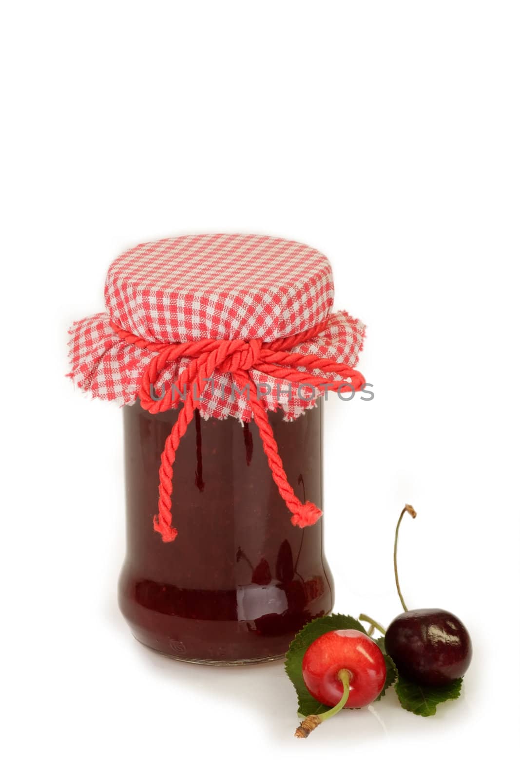 Cherry jam with fresh cherries on bright background