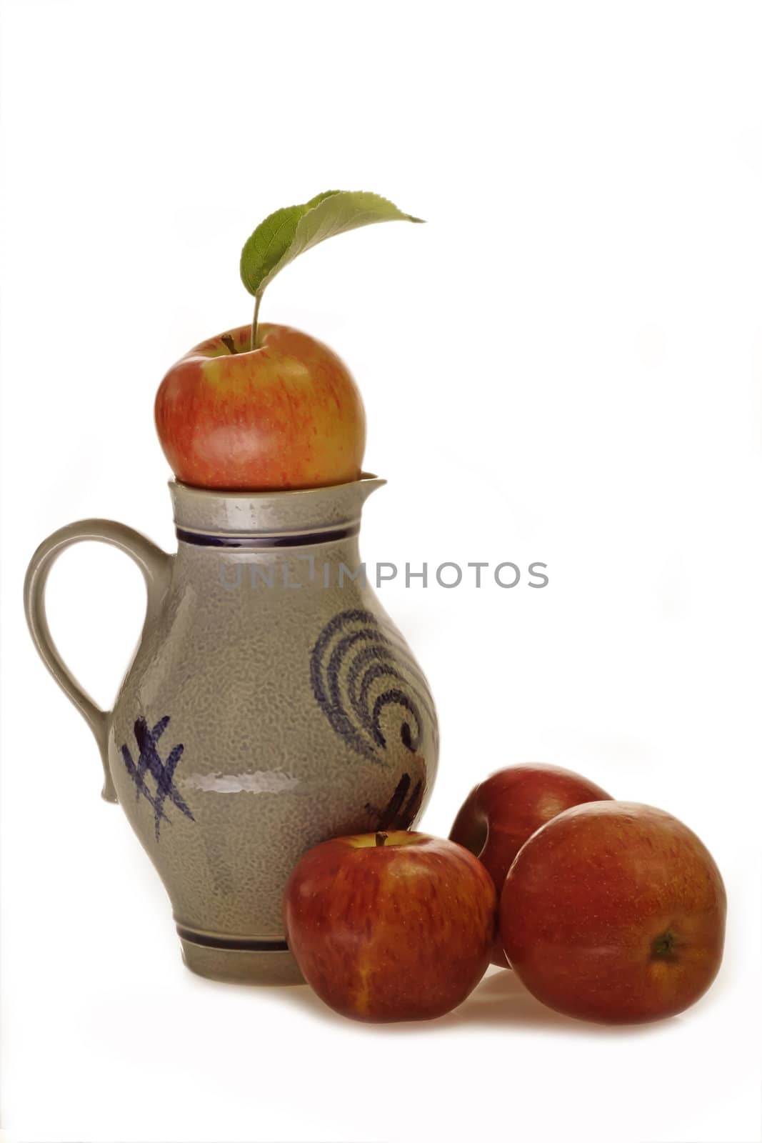 Apple wine jug with fresh apples on bright background