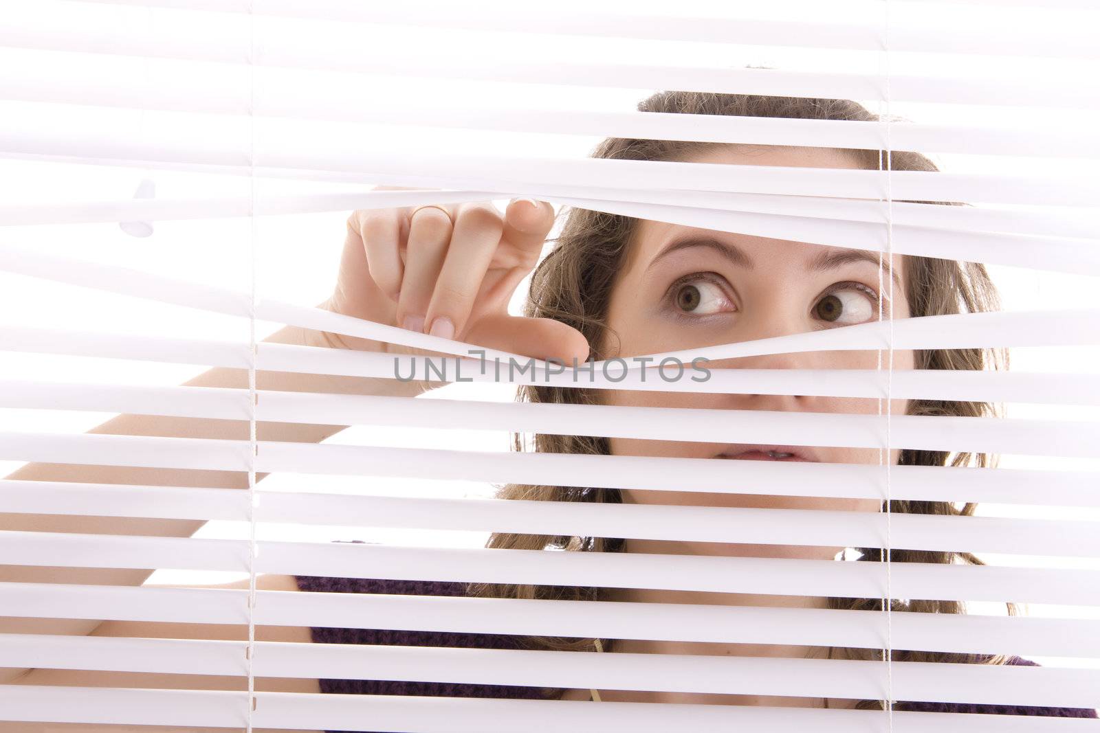 hands apart on the window blinds