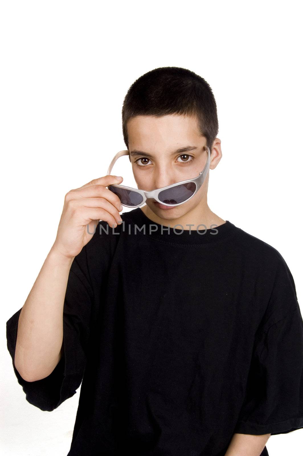 teenage boy is looking over his sunglasses