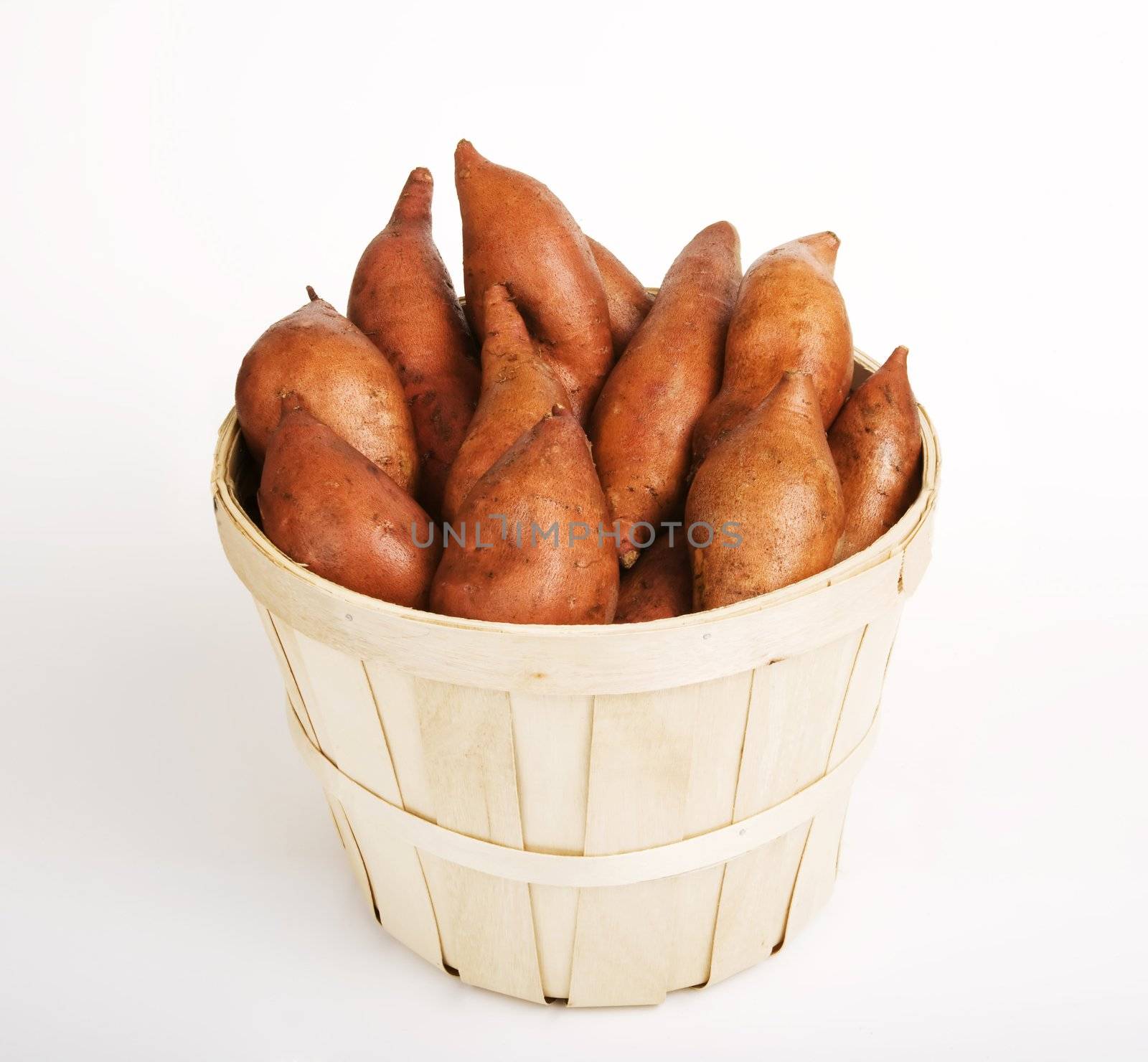 Red Sweet Potatoes gathered in a Woven Basket
