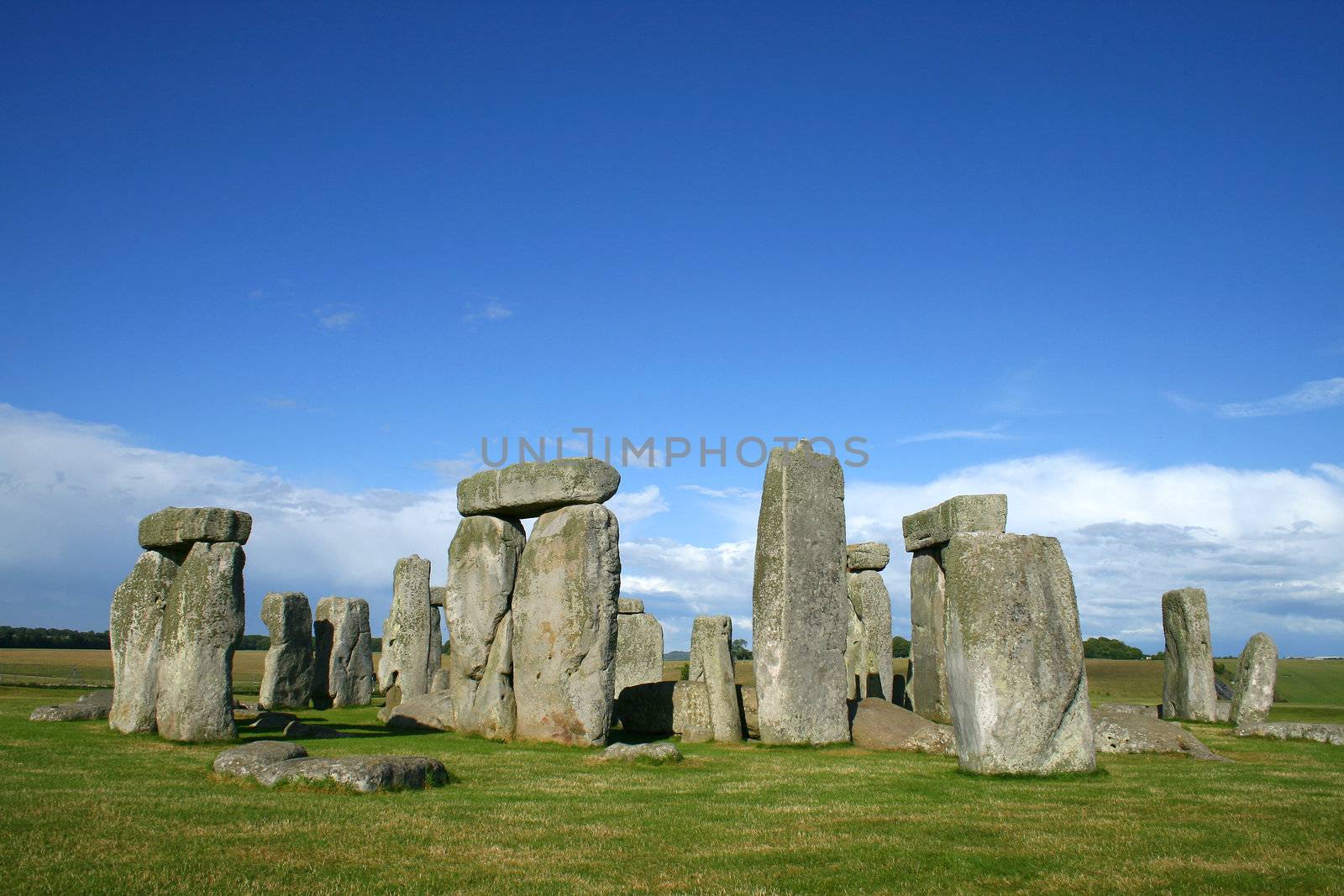 stonehenge with grass and sky