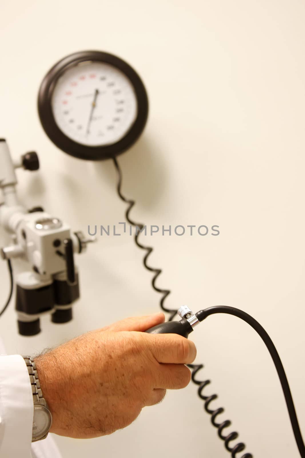 Doctor measuring blood pressure at a hospital room