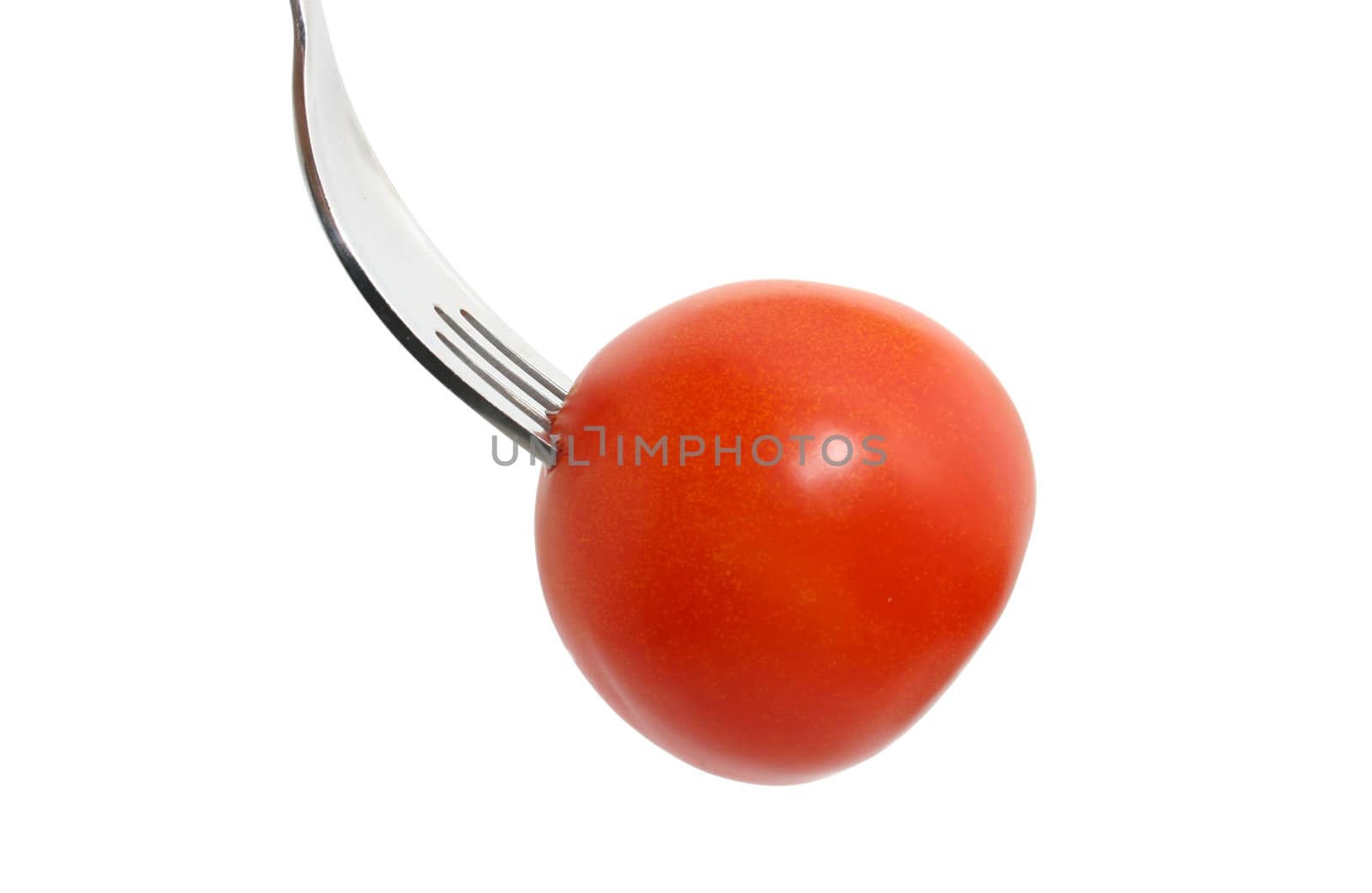 a tomato on a fork isolated on white