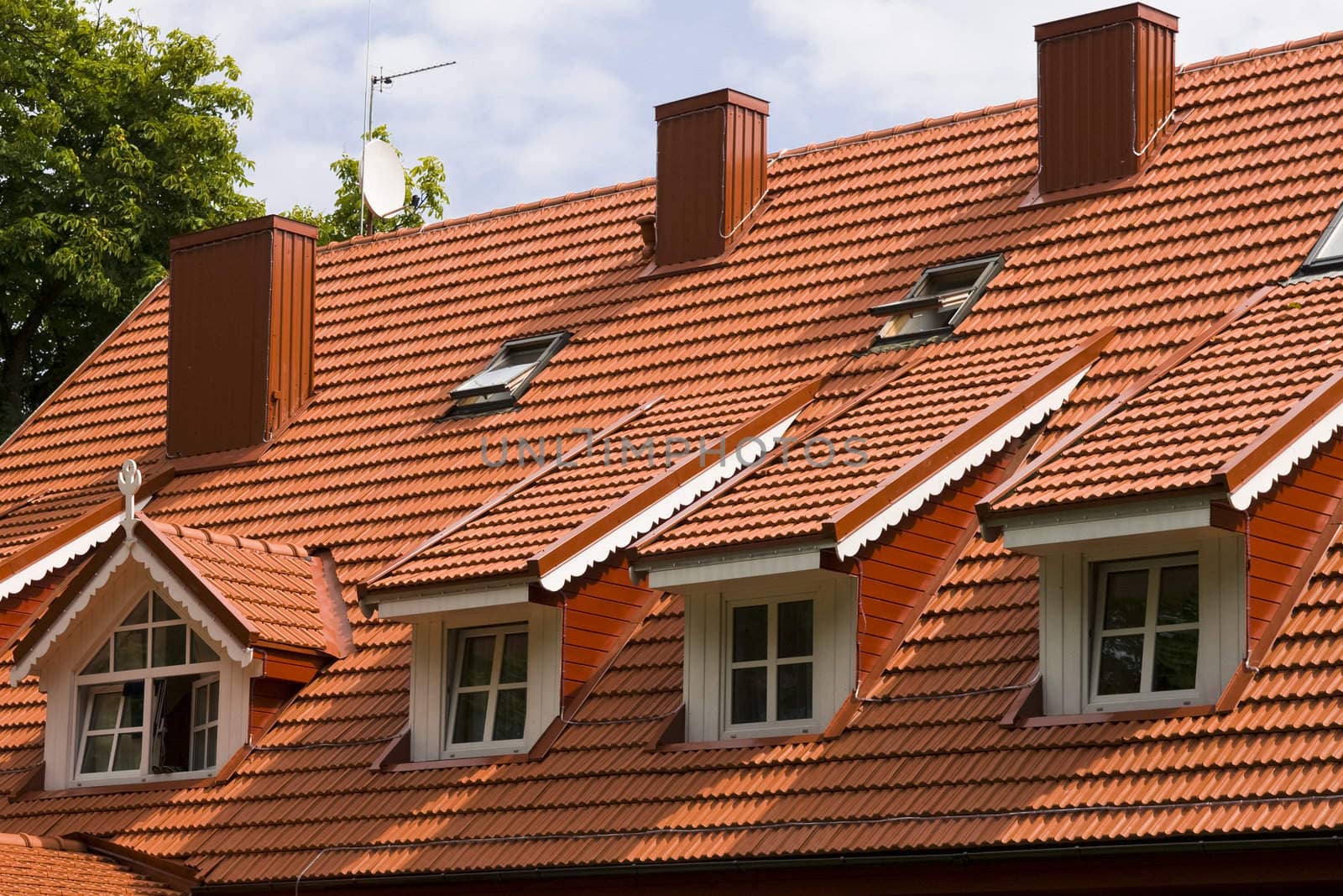 Red tile roof and gabled dormer windows in Palanga, resort of Lithuania