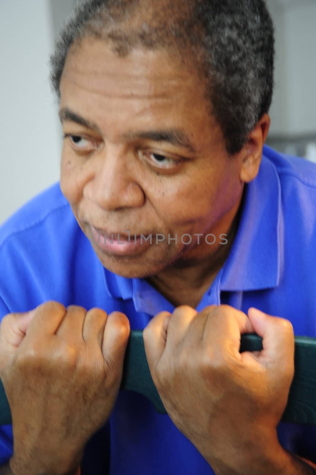 African american man exercising at home.