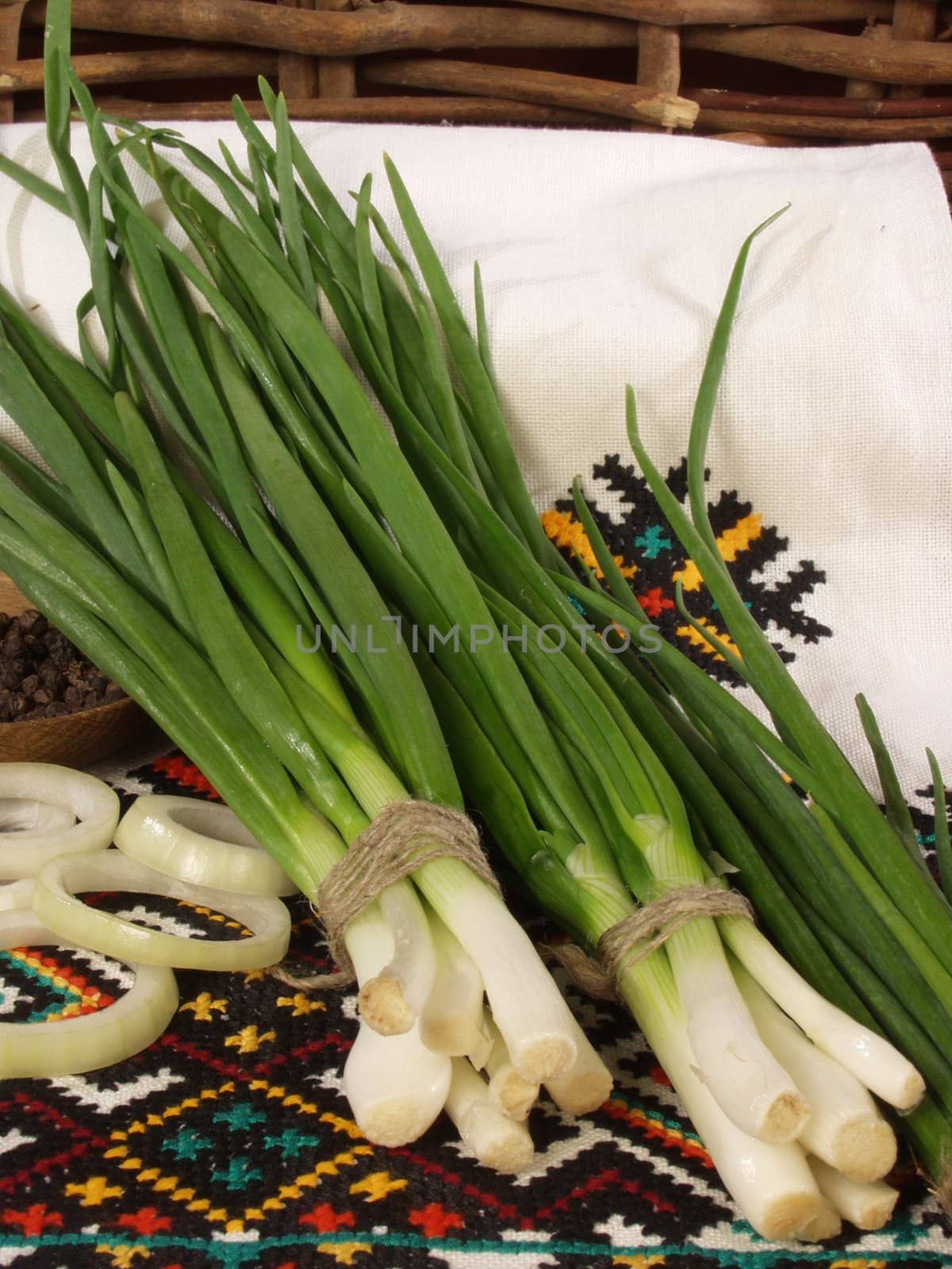 Bunches of a green onions on the Ukrainian national towels    