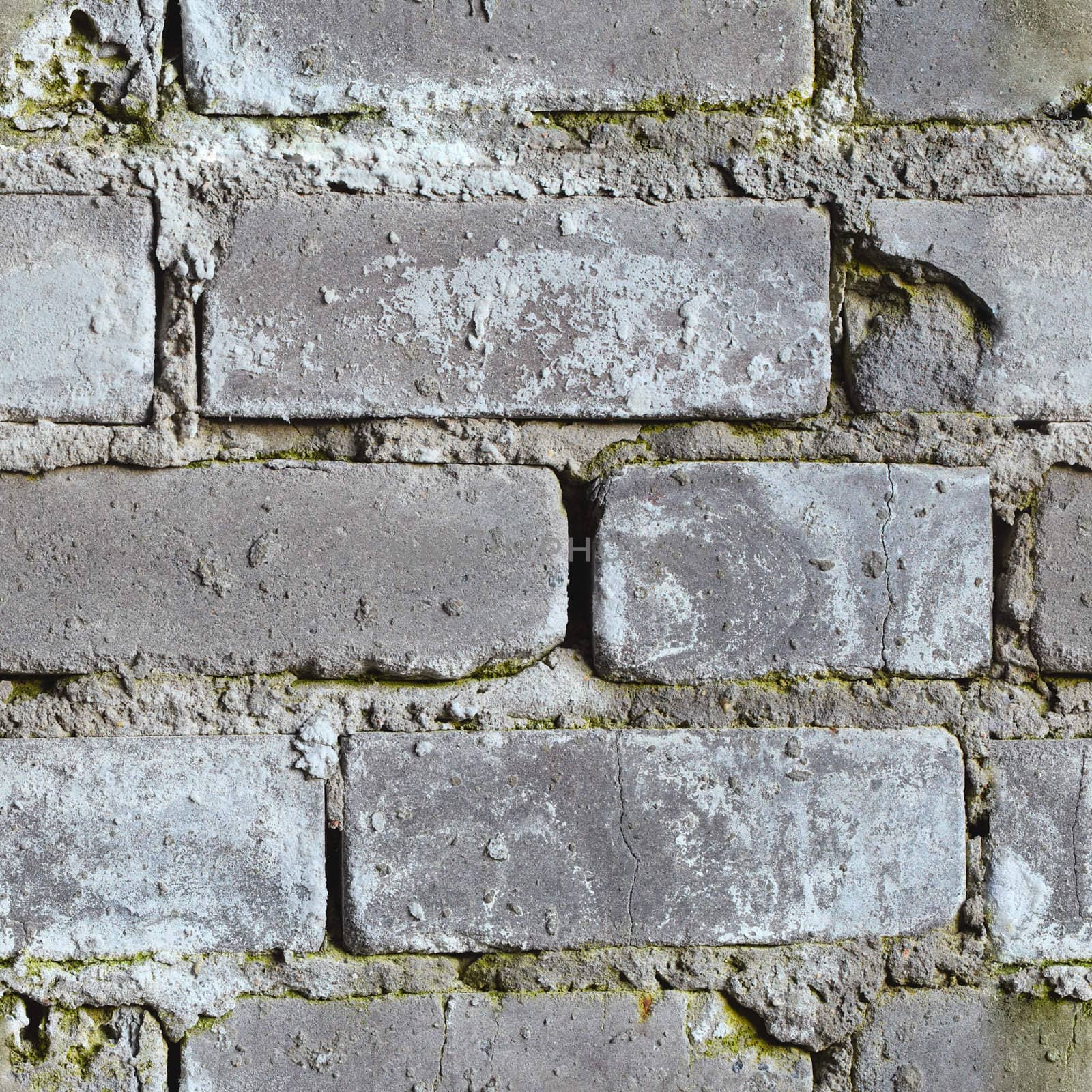 Seamless background from gray dirty moldy brick wall